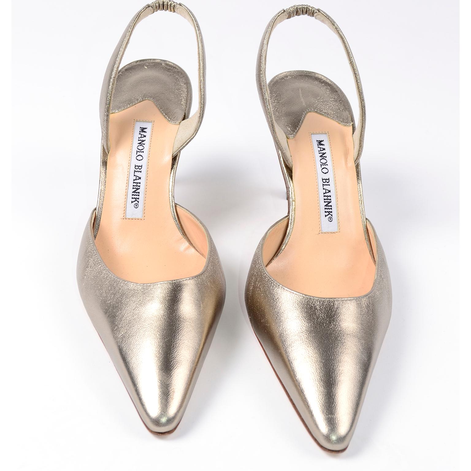 Manolo Blahniks make all feet look beautiful! These classic Carolyn style slingbacks are no exception, with the perfectly pointed toe and perfect heel. These are a metallic soft gold color leather, with never worn leather soles. They were hand made