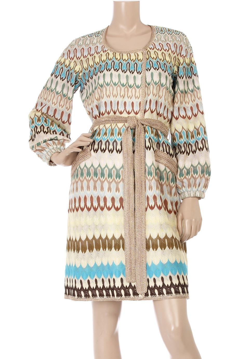 A stunning summer coat by MISSONI - impossible to find!

Multicolored silk knit coat with a double-breasted hidden press stud fastening front. 

This Missoni coat has long elasticated sleeves, a round neckline, a self-tie belt at the waist and is