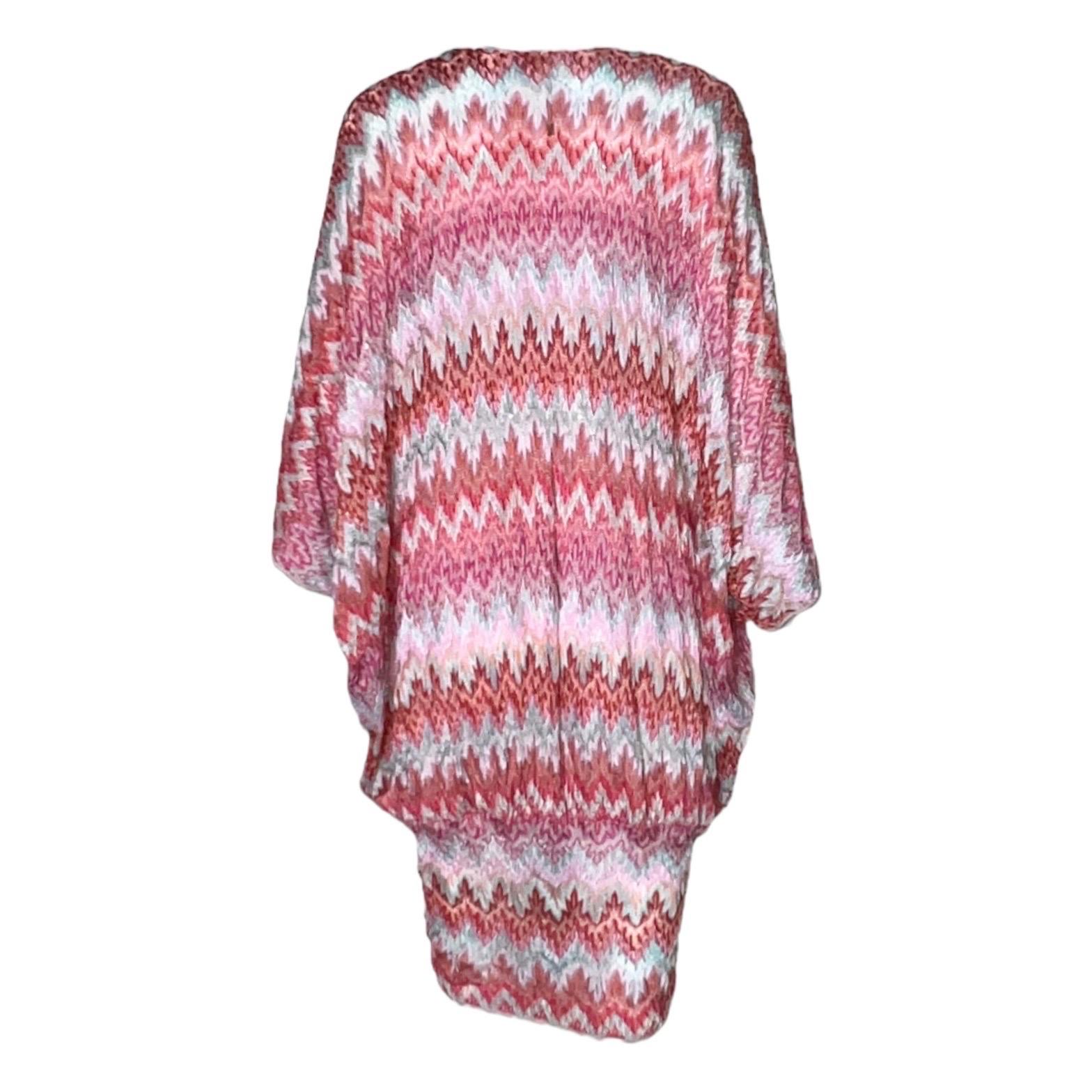 This stunning multicolored Missoni knitted mini dress epitomizes jet-set glamour. The signature geometric weave will update your look in a flash.

DETAILS:

Beautiful multicolor & pink shades
Missoni signature geometric knit weave
V-neck
Bow-tie