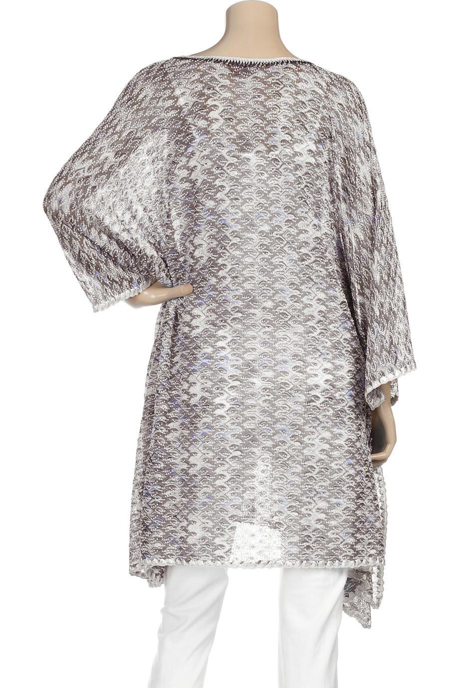 Luxe Missoni knits are perfect vacation wear and are an easy way to add some jet set glamour to your beach look. 

Layer this kaftan over a bikini or wear with jeans for evening.  

Beautiful lurex Missoni kaftan dress
Classic Missoni signature