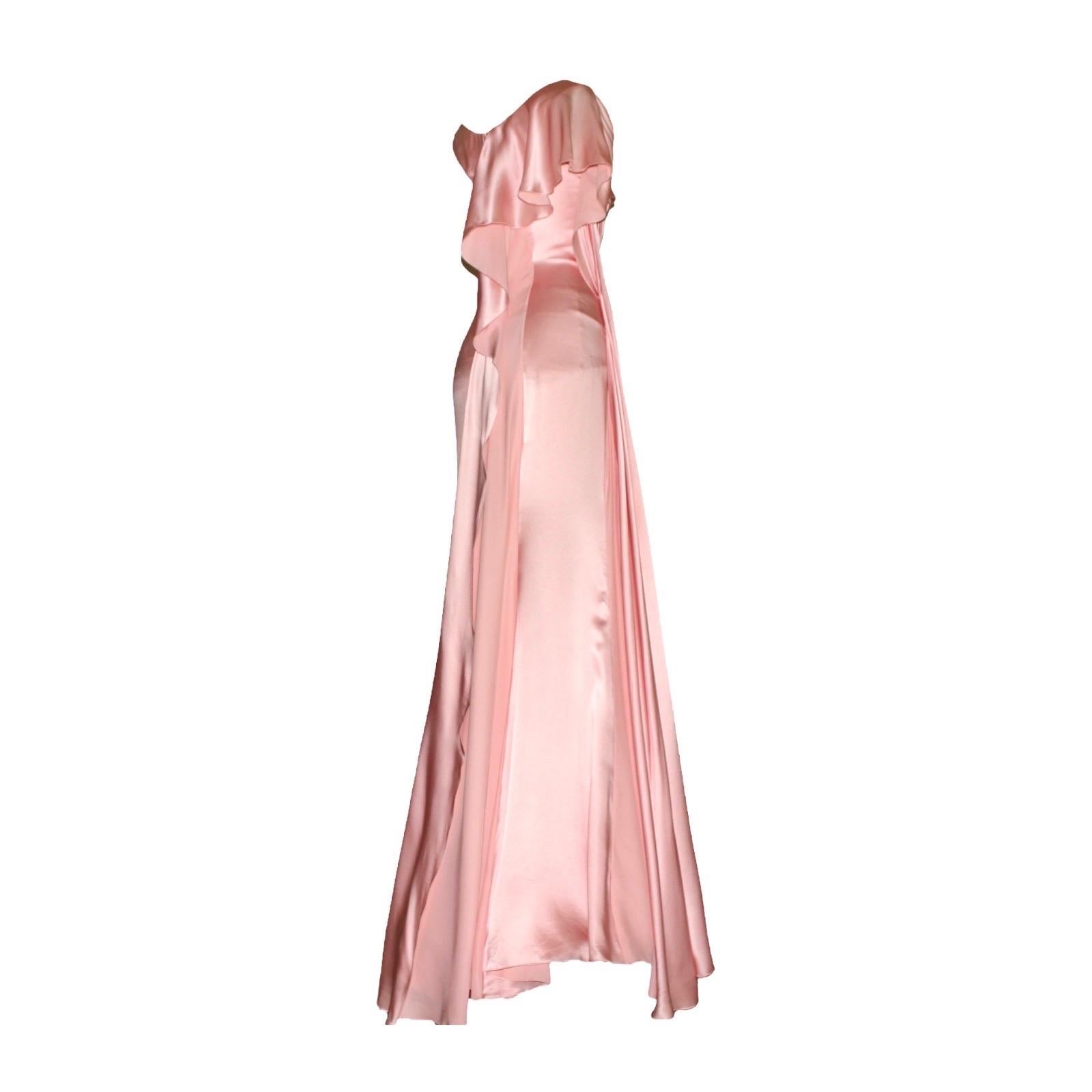 Gorgeous blush pink evening gown inspired by the Grecian goddesses by VERSACE
    Asymmetric style
    Beautiful draped details
    Ruffles/trail on side and back
    Closes with a hidden zip
    Dry Clean only
    Fully lined
Partial mesh body suit