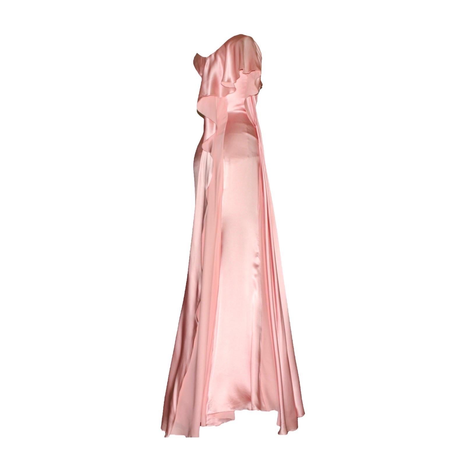 Gorgeous blush pink evening gown inspired by the Grecian goddesses by VERSACE
    Asymmetric style
    Beautiful draped details
    Silk trail on side and back
    Closes with a hidden zip
    Dry Clean only
    Lined with silk
Partial mesh body