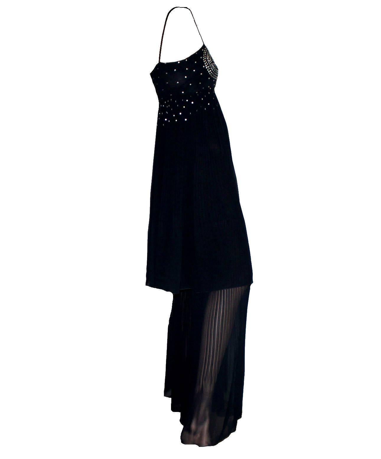 Amazing evening jumpsuit by Chanel
Stunning harem style
Wide palazzo legs
Finest midnight blue chiffon silk
Pleated details
Embroidered sequins on upper part
CC logo plate
Simply slips on
Zip on side
Made in France
Dry Clean Only
Size 38
Unworn
