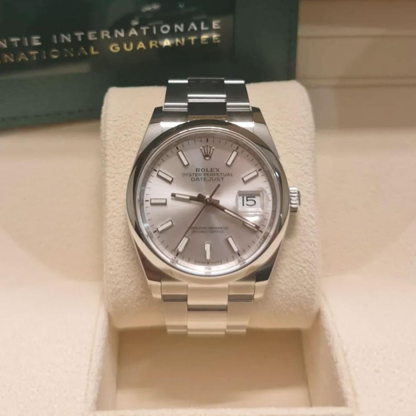The Rolex Datejust 36 126200-0002 is a refined expression of Rolex’s timeless design, crafted for those who value both elegance and precision. Its 36mm Oystersteel case offers exceptional durability while maintaining a sleek, versatile profile