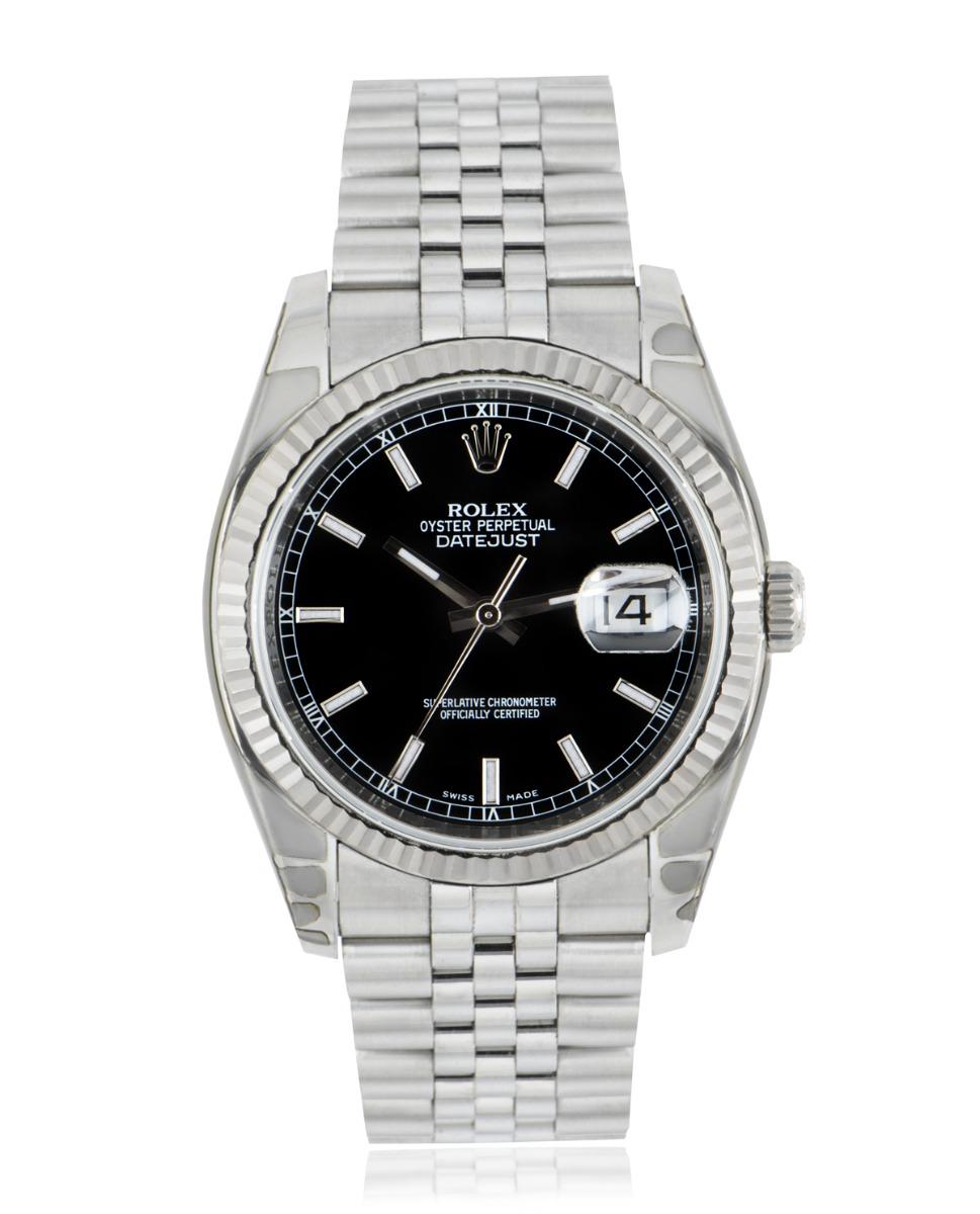 An unworn NOS 36mm Datejust by Rolex in stainless steel. Features a black dial and an iconic fluted white gold bezel. A Jubilee bracelet comes equipped with a concealed folding Crownclasp. Fitted with scratch-resistant sapphire crystal and a