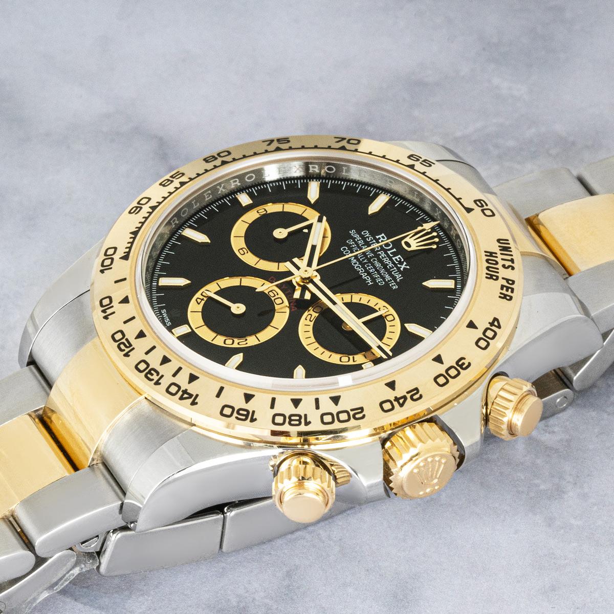 An unworn Daytona from Rolex in Oystersteel and yellow gold. Features a black dial with applied hour markers. With an engraved tachymetric scale, three counters and pushers, the Daytona was designed to be the ultimate timing tool for endurance