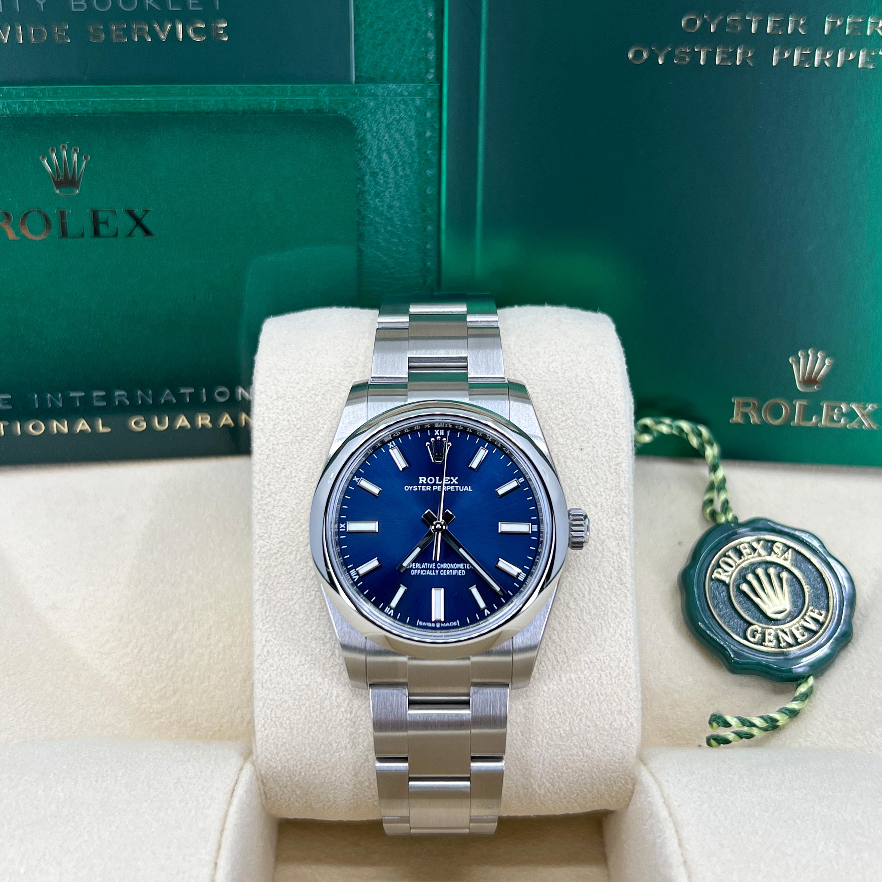 The Rolex Oyster Perpetual 34 is a masterful expression of Rolex’s enduring legacy of precision, reliability, and understated sophistication. Crafted from robust brushed stainless steel with polished sides, the 34mm Oyster case embodies timeless