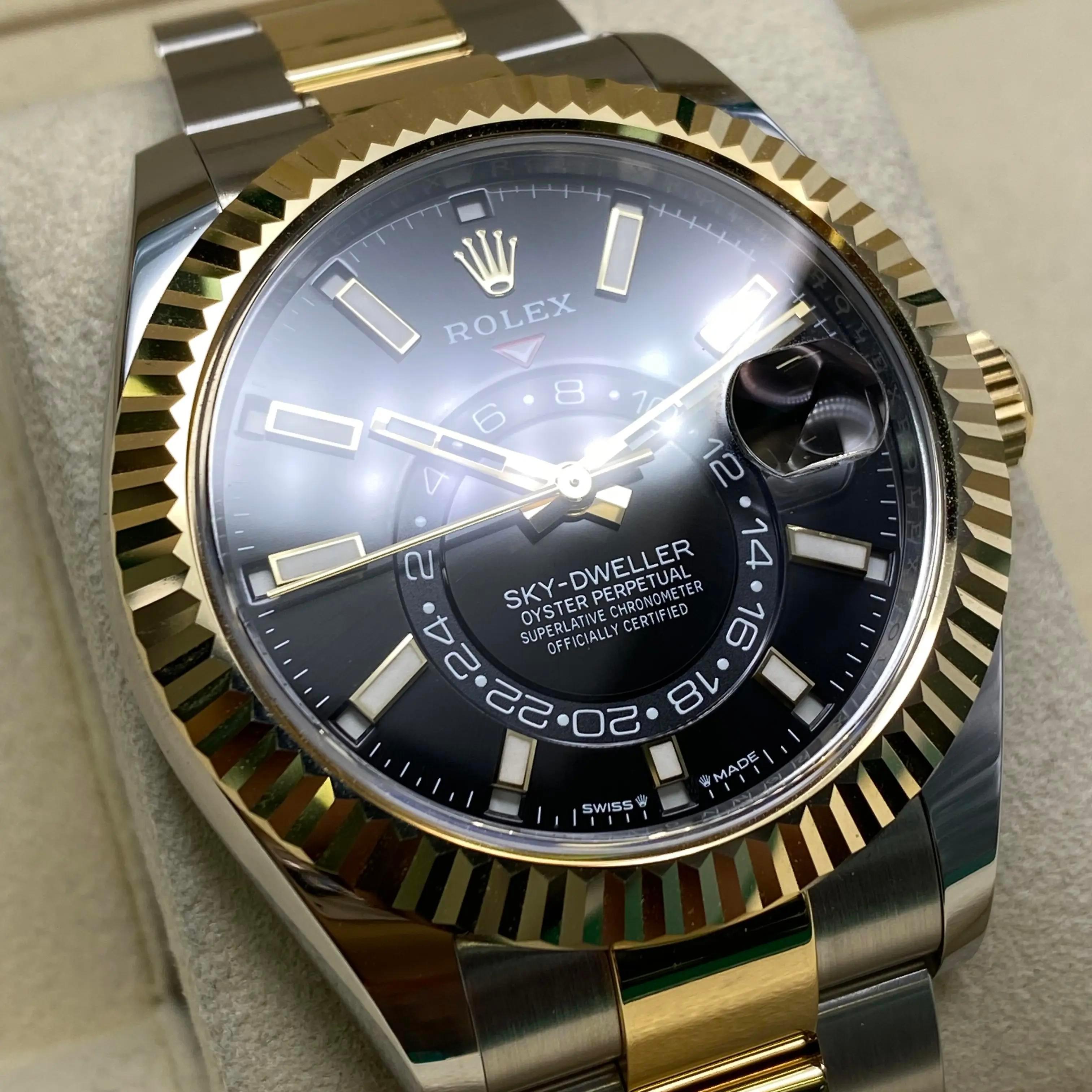 Unworn Rolex Sky-Dweller 336933 42mm Steel 18K Yellow Gold Black Dial Watch B&P In New Condition For Sale In New York, NY