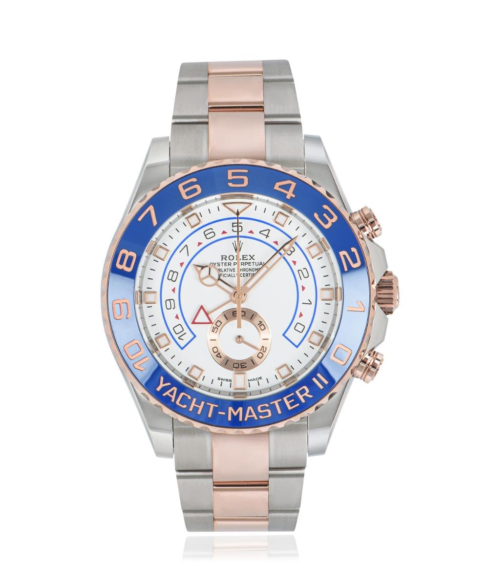 A Rolex Yacht-Master II in Oystersteel 44mm and rose gold, featuring a white dial with a 10-minute countdown and small seconds display. The rose gold bidirectional rotatable ring command bezel features a blue ceramic insert with numerals coated in