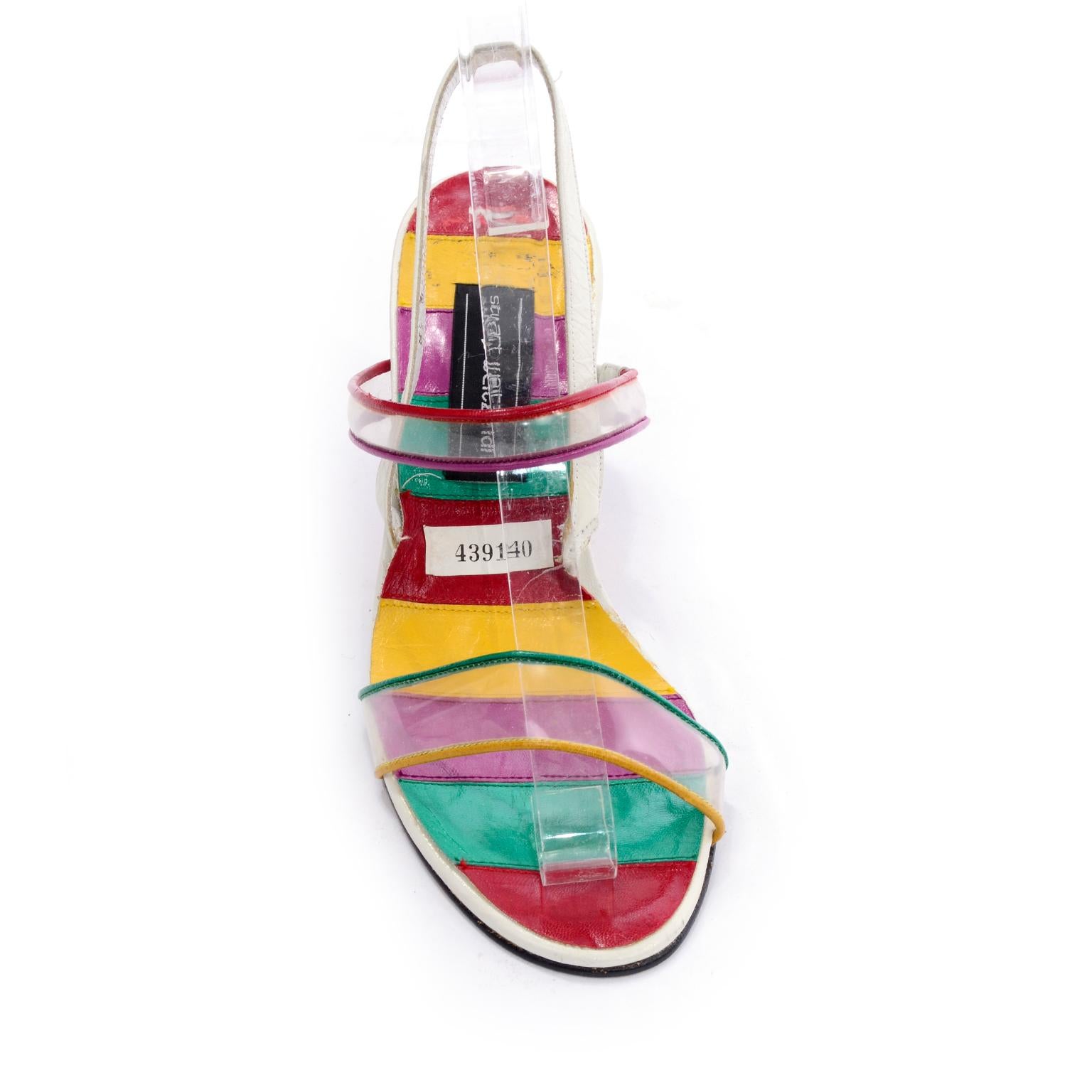 These vintage Stuart Weitzman rainbow sole heeled sandals are to die for! These fantastic vintage shoes have a diamond shaped hole in the wege heels, plastic straps and white slingback straps. The colors include shades of purple, green, red and