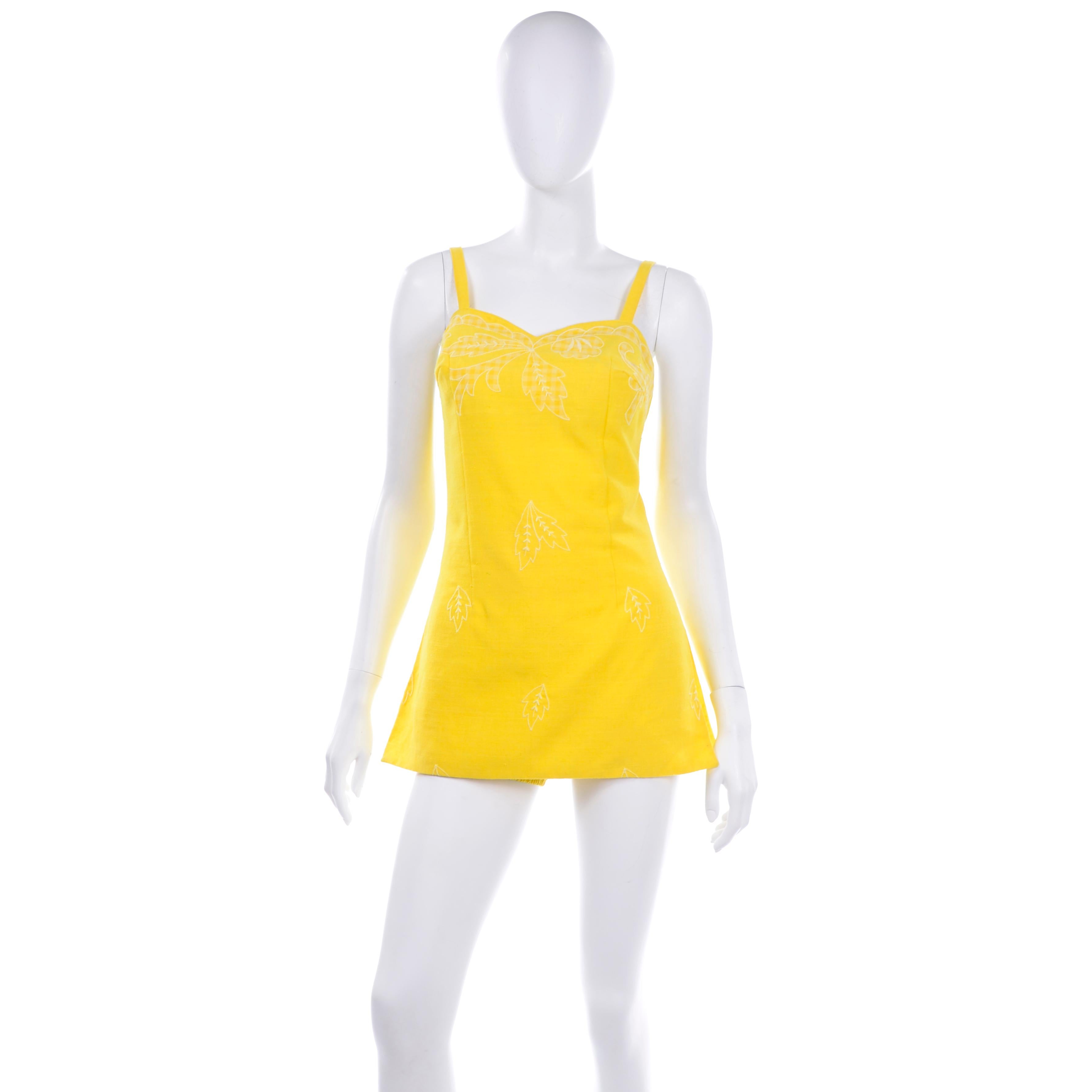this is a pristine Tina Leser for GaBar New York vintage, never worn early 1960s swimsuit or romper. We love the  fabulous shade of sunshine yellow and the checked gingham applique at bustline and pretty white leaf embroidery. This is a super