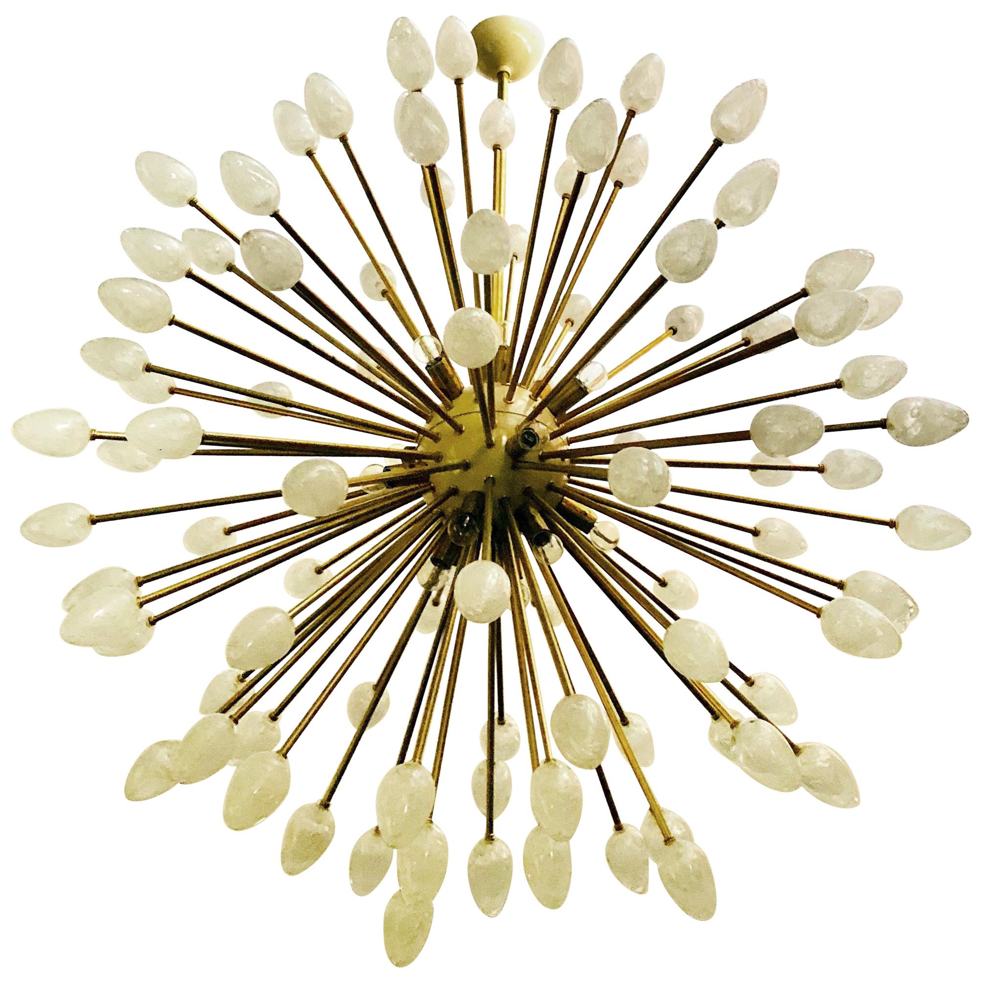 Italian Sputnik chandelier with clear egg shaped Murano glasses with hand blown bubbles within the glass to create a rock crystal effect, cream enameled centre and canopy, mounted on brass frame / Designed by Fabio Bergomi for Fabio Ltd / Made in