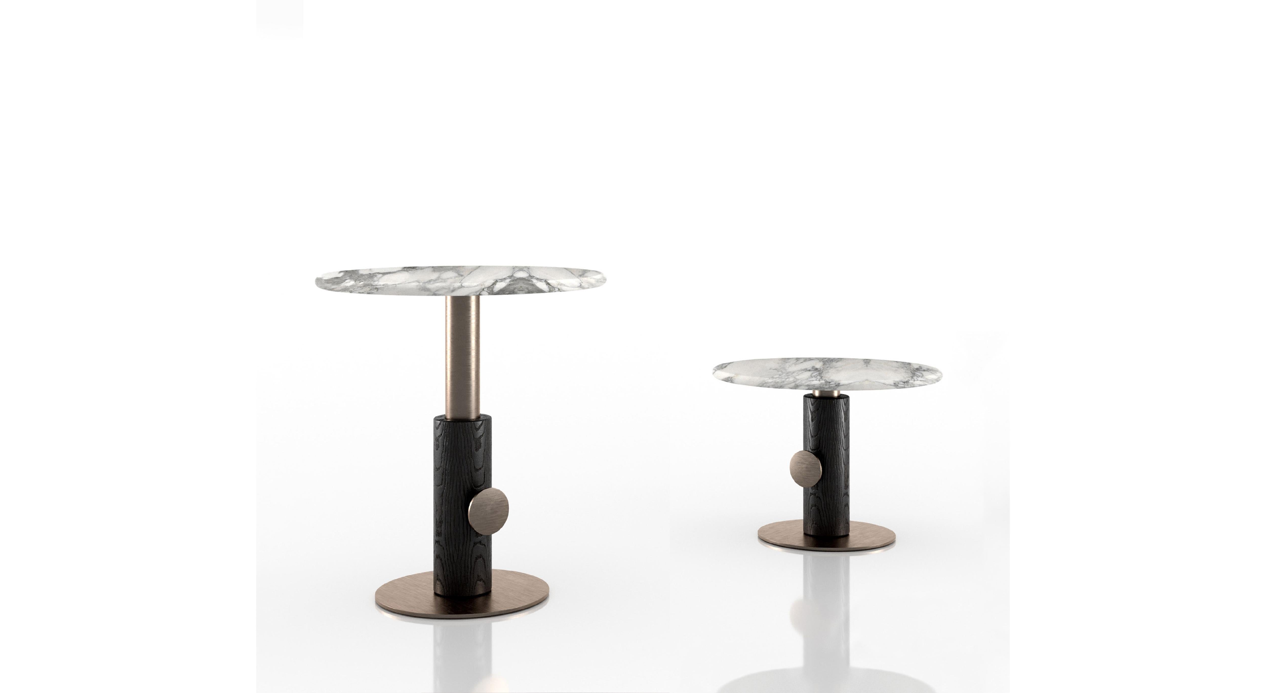 The choice of this name, Up & Down, is not random, as you can adjust its height. It can be low or high and in function to this it can meet different needs. An elegant coffee table, composed of a round marble top in contrast with the wooden base and