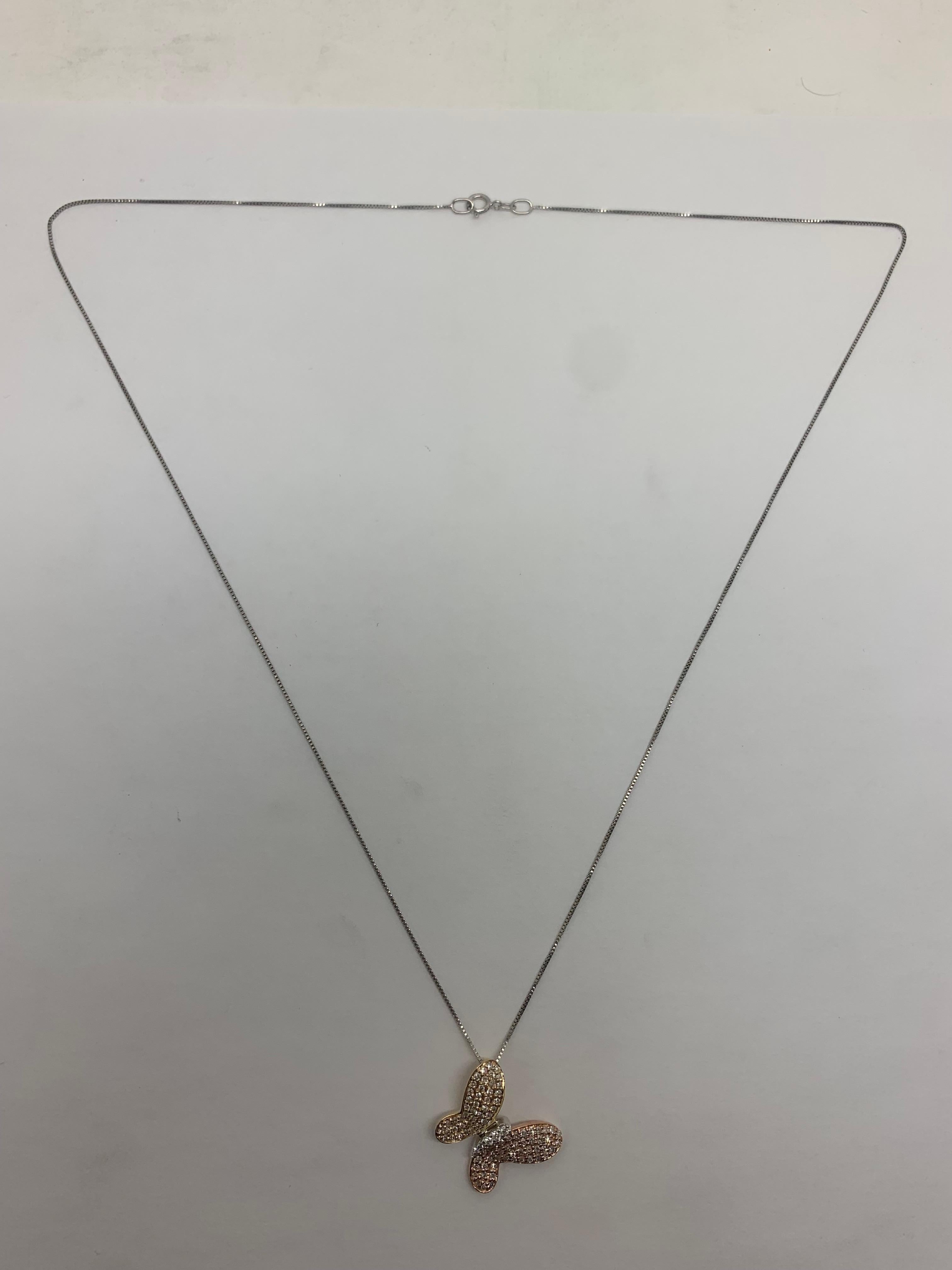 Up for sale: 

This amazing looking solid 14k Tri Colored round cut natural diamond butterfly pendant chain necklace. The necklace is featuring approx 0.50ctw in round cut natural diamonds; G color; VS2 clarity; very good cut--Amazing life and