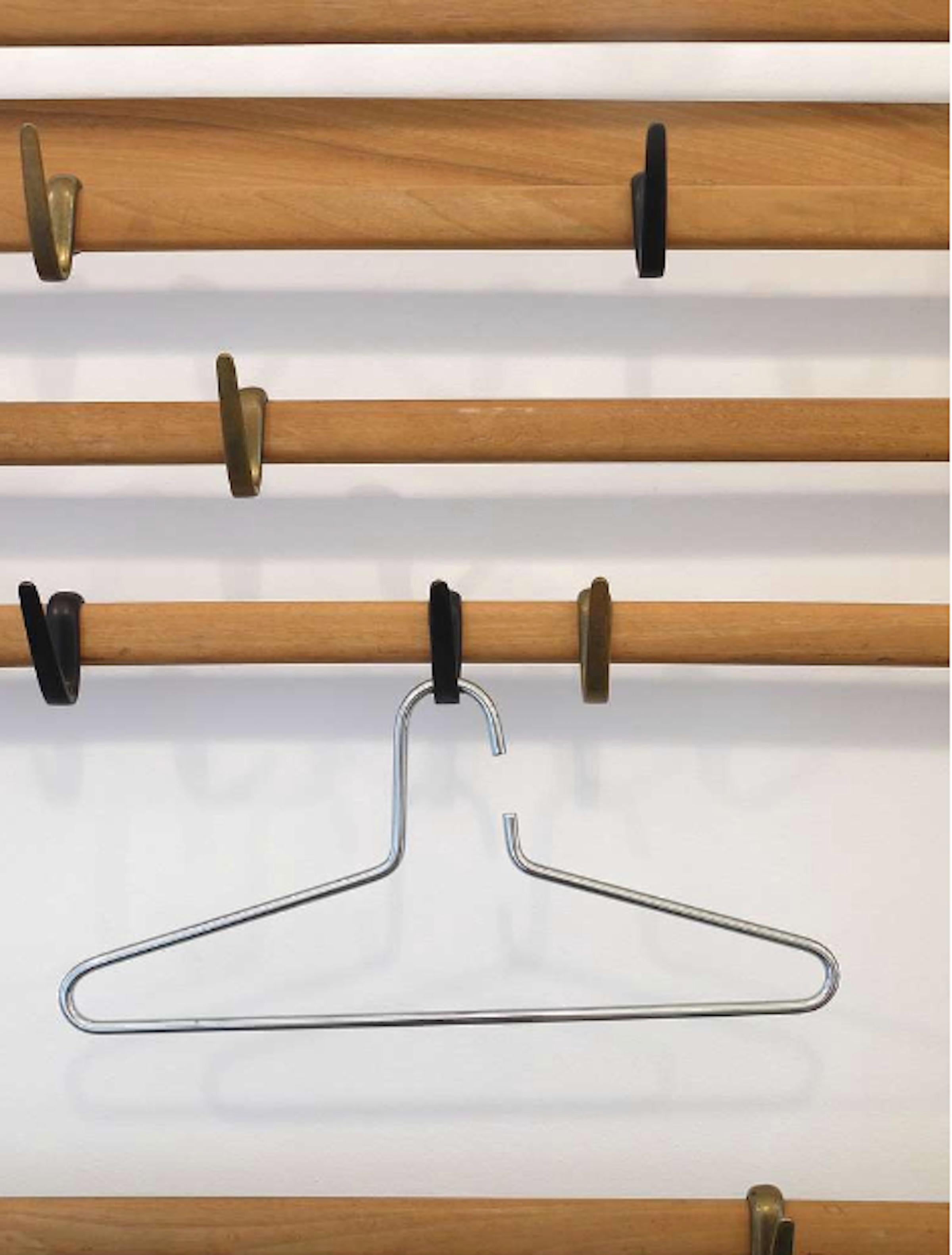 Up to 12 beautiful and heavy chrome-plated hangers made in Austria in the 1970s. These very solid and stylish pieces are in very good condition, each measuring 16 1/2 inches wide. There are up to 12 hangers available, sold and priced individually.