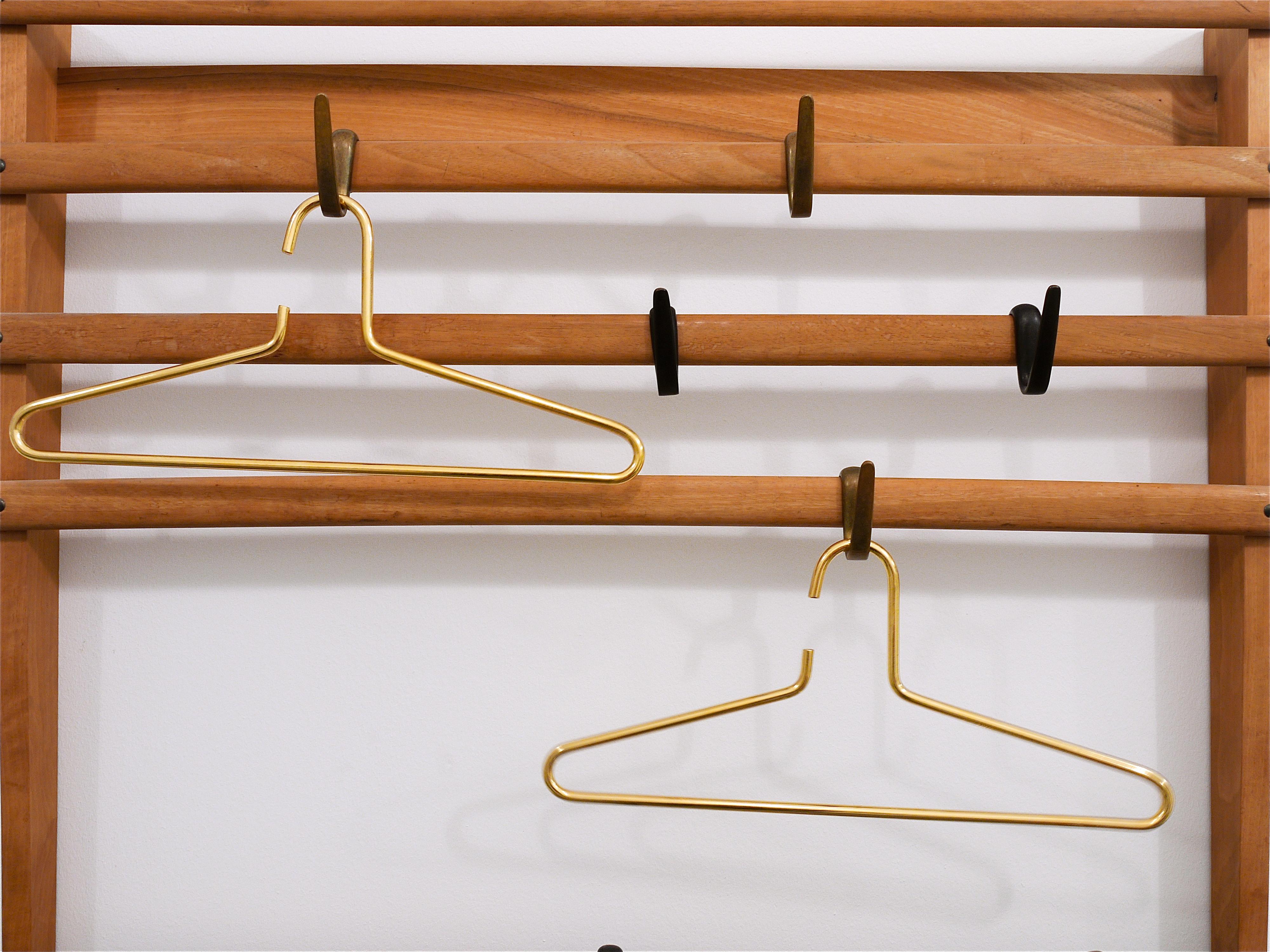 Up to 12 beautiful and heavy chrome-plated hangers executed in Austria in the 1970s. Very solid and stylish pieces in excellent condition. Measures: 16 1/2 in wide. There are up to 12 hangers available, sold and priced per piece. We offer identical