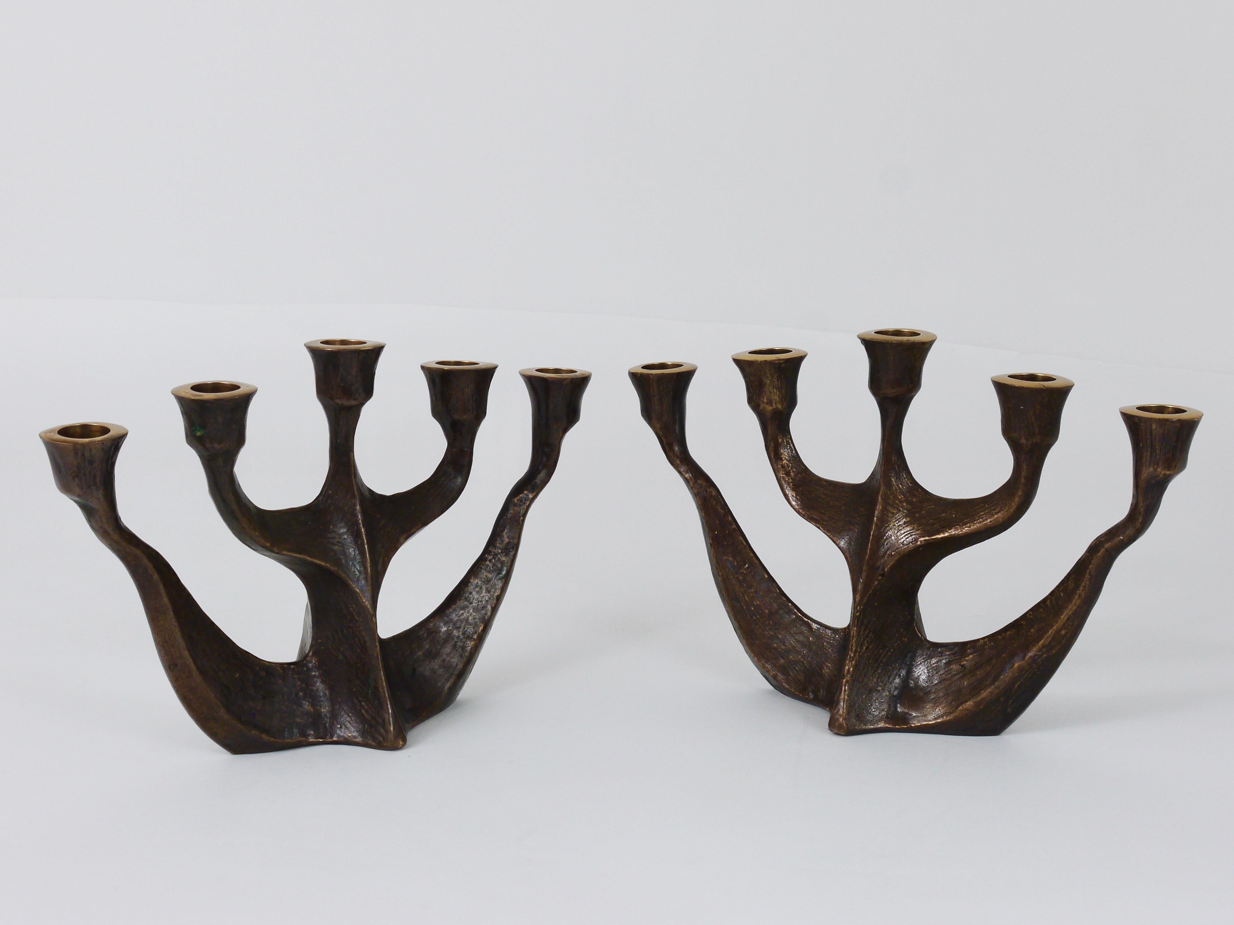 Up to two beautiful matching Brutalist five-arms candleholders, made of solid bronze from the 1960s. Designed and executed by Michael Harjes, Germany. In very good condition. There are two identical candleholders available, sold and priced per