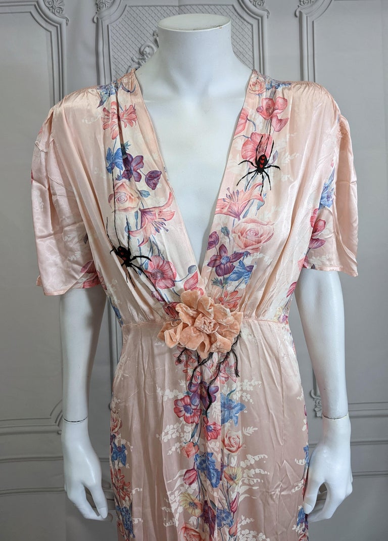 Upcycled Art Deco Black Widow Floral Dressing Gown by Studio VL. 1930's rayon print pink floral gown with striped floral patterning throughout. We have hand embroidered black widow spiders coming down each side from buds, each embroidered with red