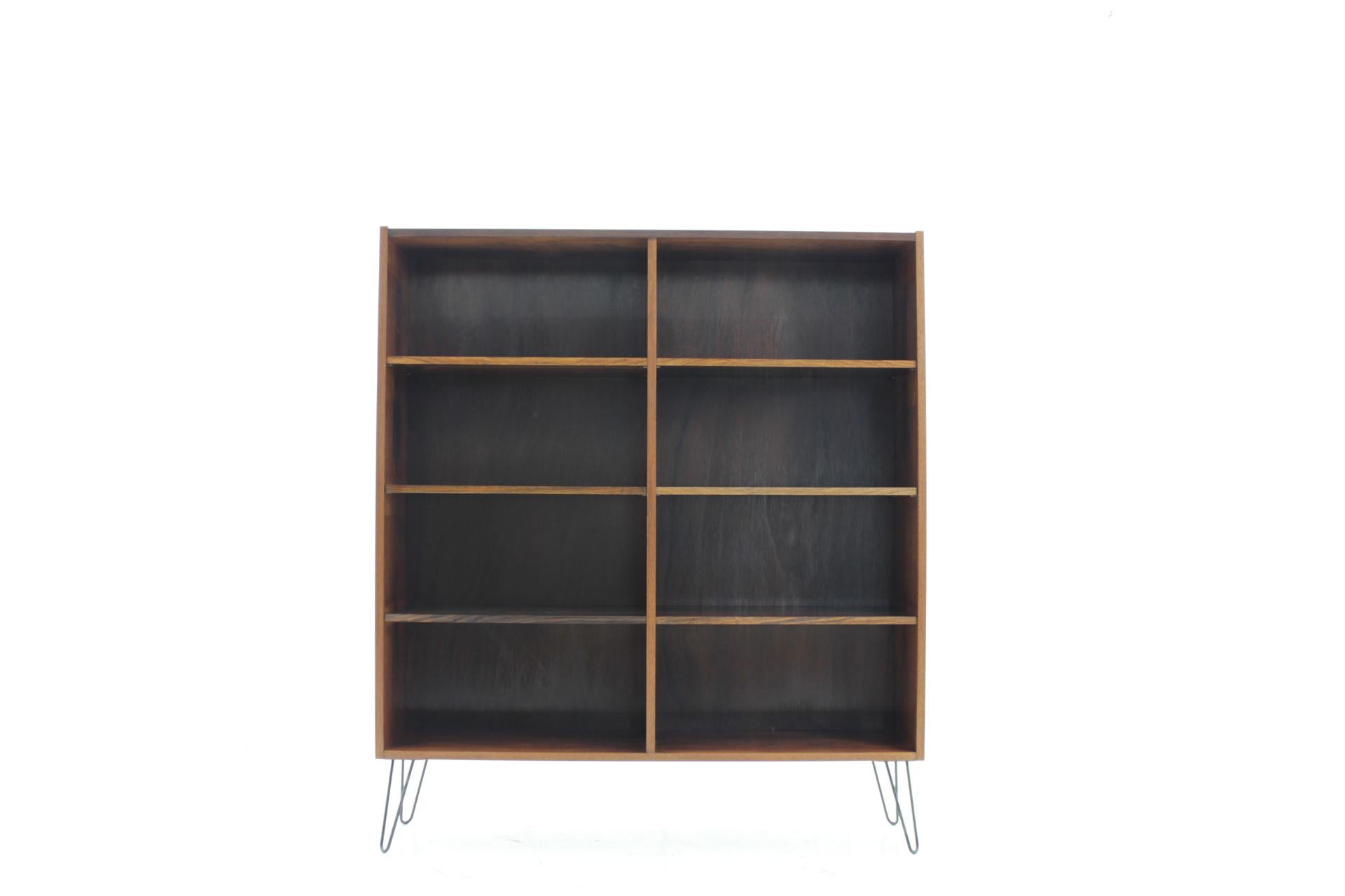 This bookcase was carefully restored. The hairpin iron legs were added afterwards.