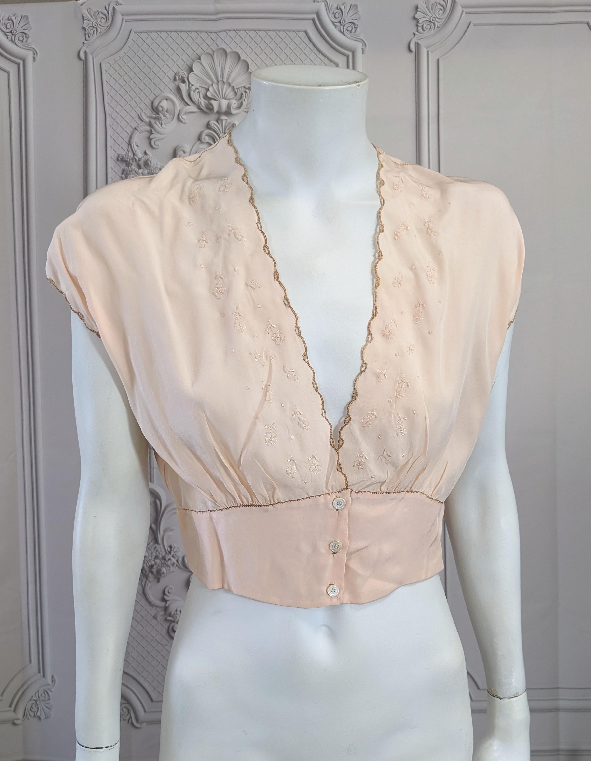 Upcycled Silk Crepe Art Deco Top by Studio VL. Pink silk crepe lingerie top with floral embroidery down front to 3 mother of pearl buttons. We have added a young wide eyed girl, who has your back, both figuratively and literally. Hand embroidered