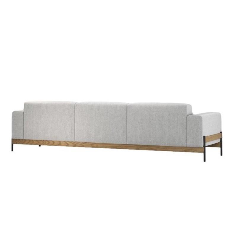 This elegantly crafted sofa is designed for both visual appeal and comfort, making it a perfect addition to varied environments like living rooms and hotel lobbies. It features a simple yet impactful detail that harmoniously combines the sleekness