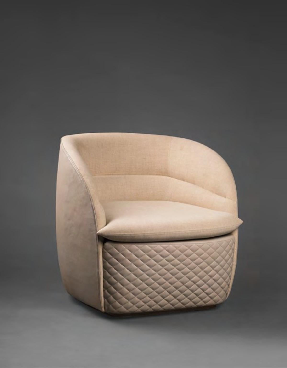 Upholstered Annis Armchair by Madheke
Dimensions: W 85 x D 89 x H 82 cm
Materials: Leather, Fabric

Quilted front, upholstered back and outer.

Reflecting the finest in craftsmanship, innovation and heritage, Madheke creates tailored and