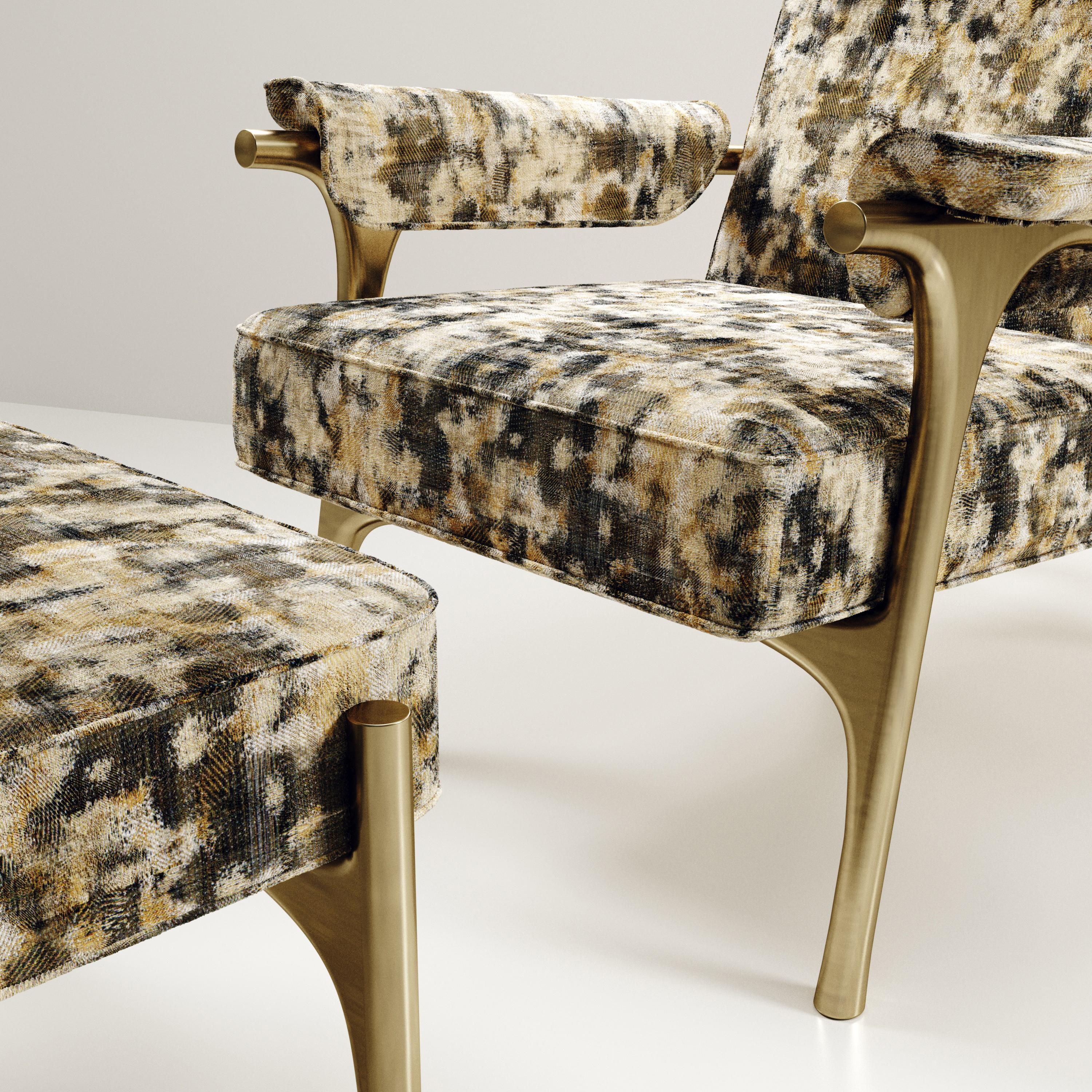 French Upholstered Armchair and Footstool with Brass Details by R&Y Augousti For Sale