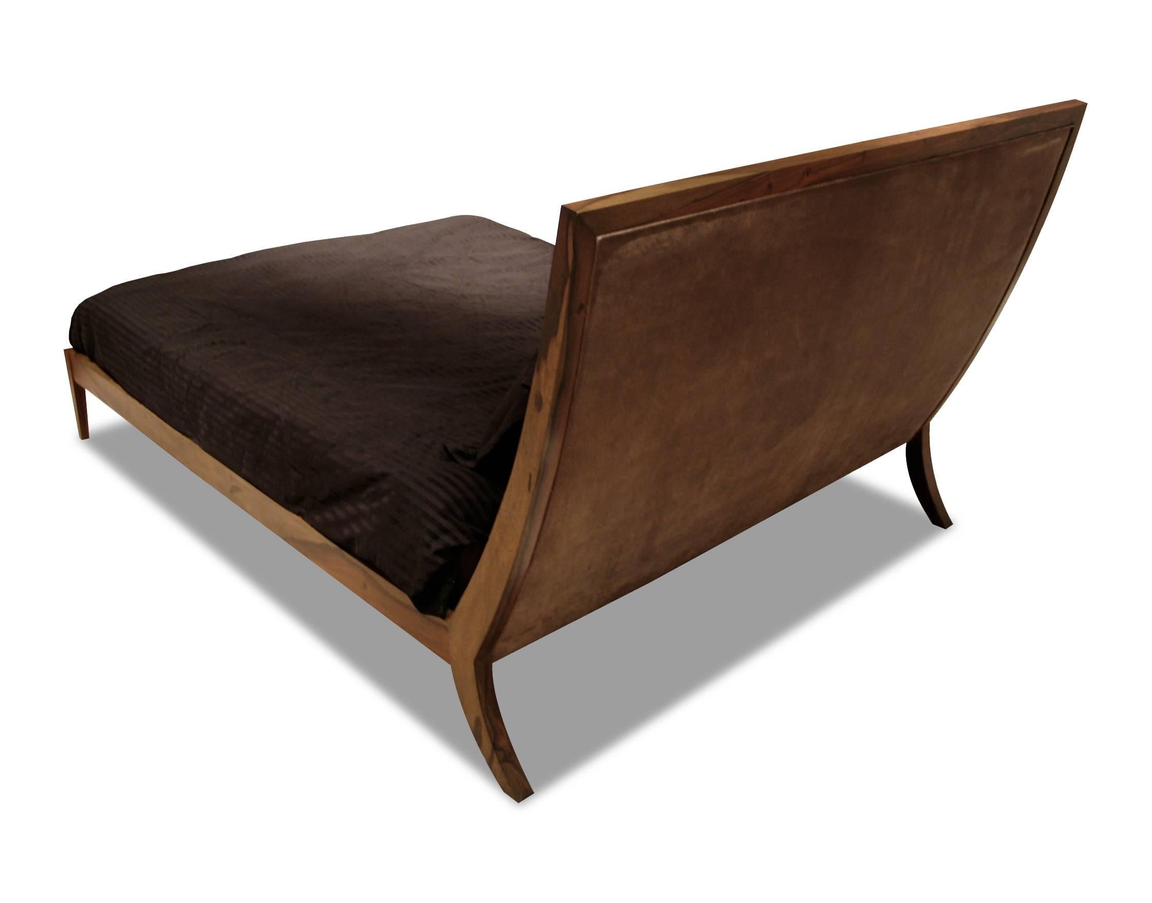 The Belgrano bed from Costantini is handmade using solid wood (shown in Argentine rosewood) and an upholstered headboard, shown in leather, but available in any fabric, leather or COM/COL.

It features an ergonomic headboard that eliminates the