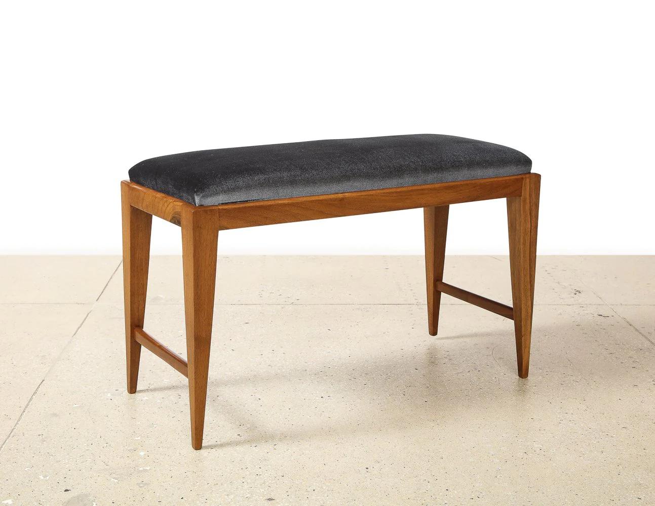 Walnut, upholstery. Sleek and modern upholstered bench.  