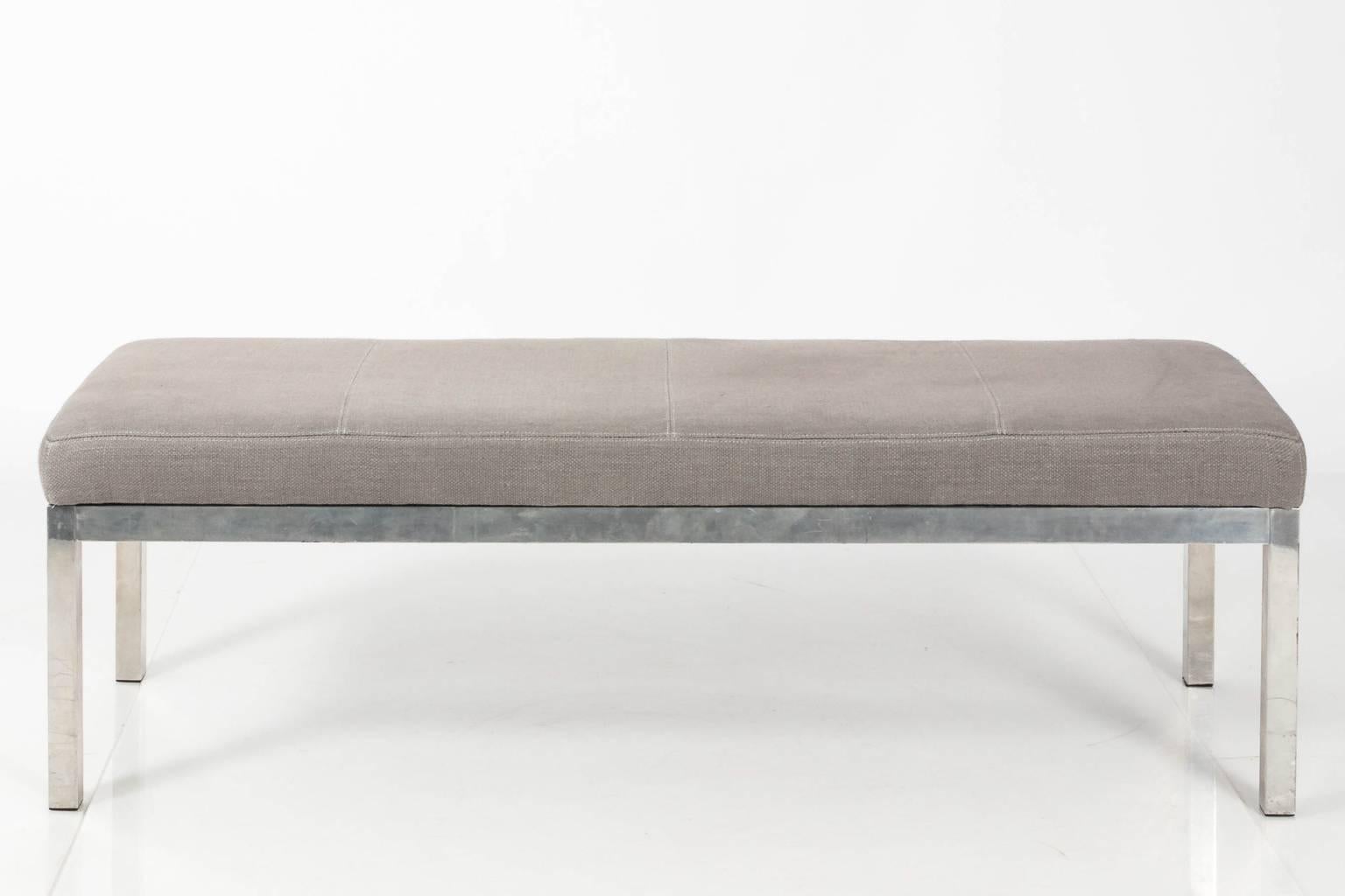 Vintage upholstered bench with chrome base. Newly upholstered in grey linen.