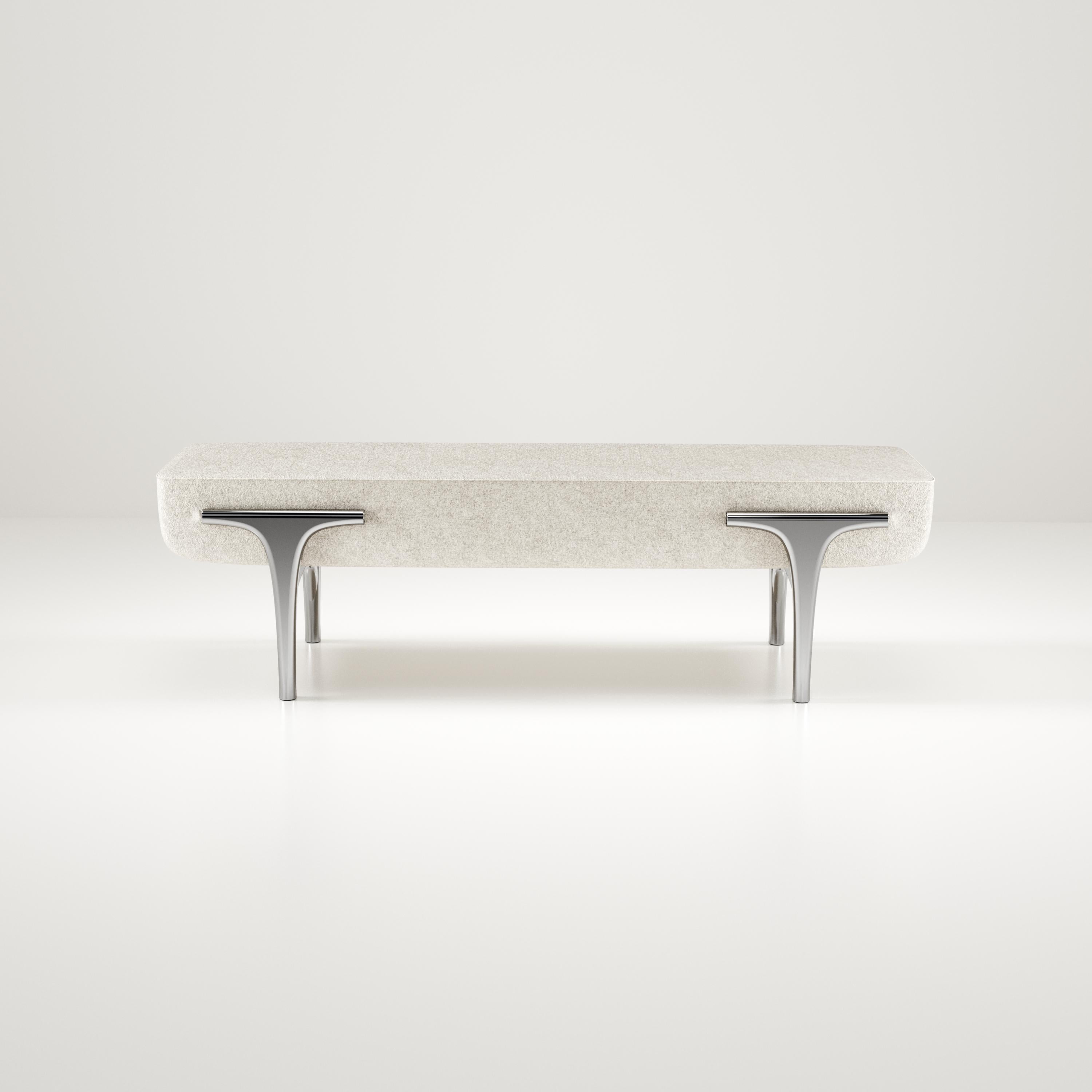 The Ramo bench by R & Y Augousti is an elegant and versatile piece. The upholstered piece provides comfort while retaining a unique aesthetic with the chrome finish polished stainless steel frame and details. This listing is priced for COM supply by