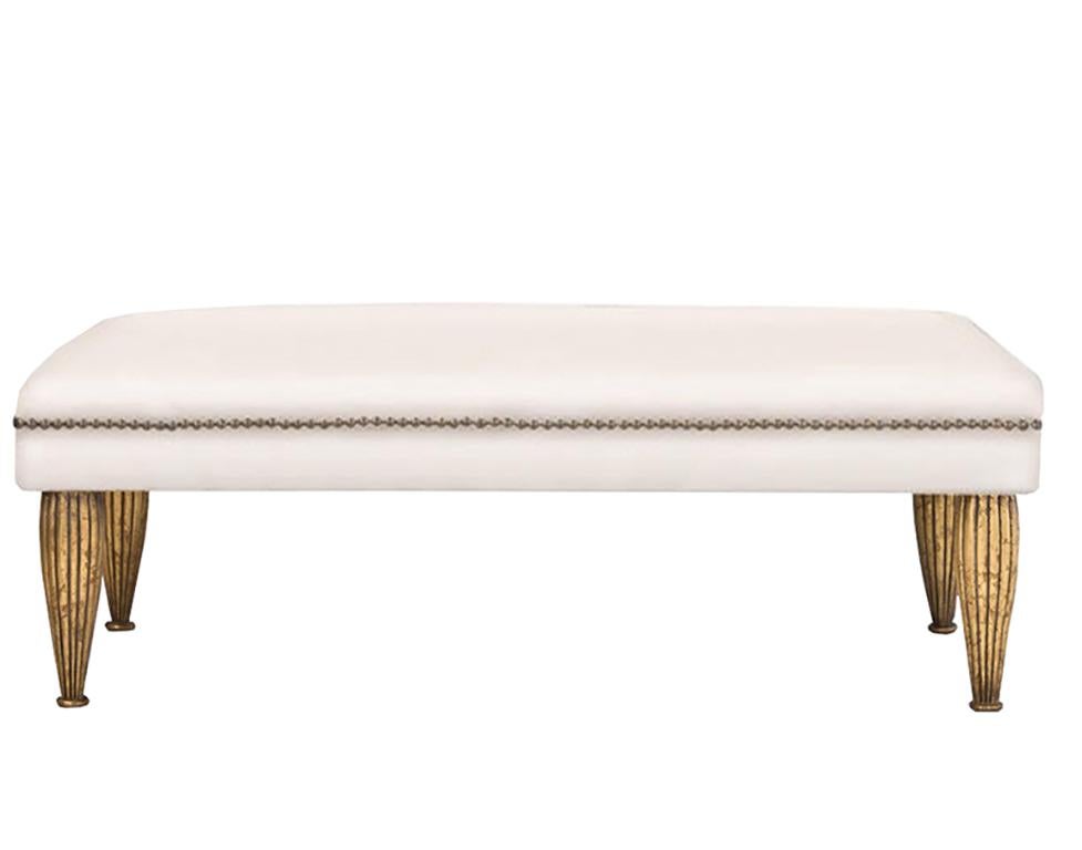 Contemporary Bench upholstered in hide or Belgian linen and nailhead trim is part of the custom Tara Shaw Maison collection. Handcrafted in New Orleans. Standard bench available upholstered in white cowhide or linen.

Custom dimensions, finish and