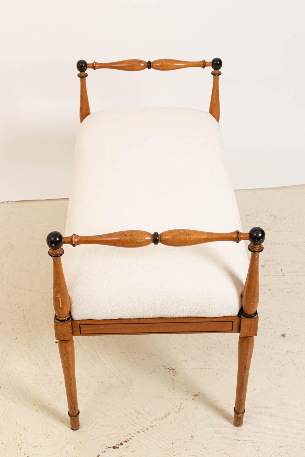 Upholstered Biedermeier style bench with turned armrests, circa 1940s. The piece has also been freshly upholstered. Please note of wear consistent with age including finish loss and scratches. Made in Italy.