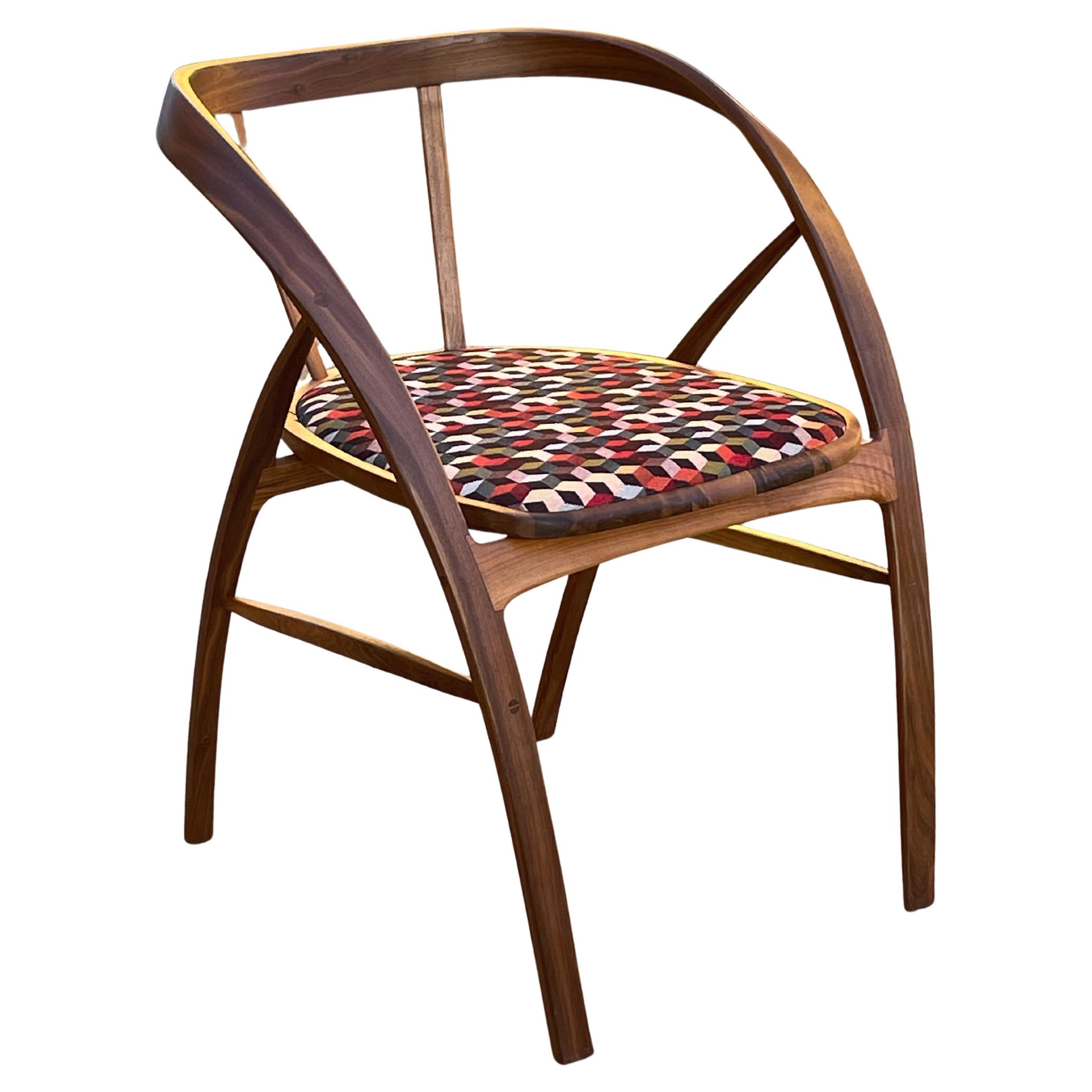 Upholstered Carol Dining Chair in walnut by Jonathan Field