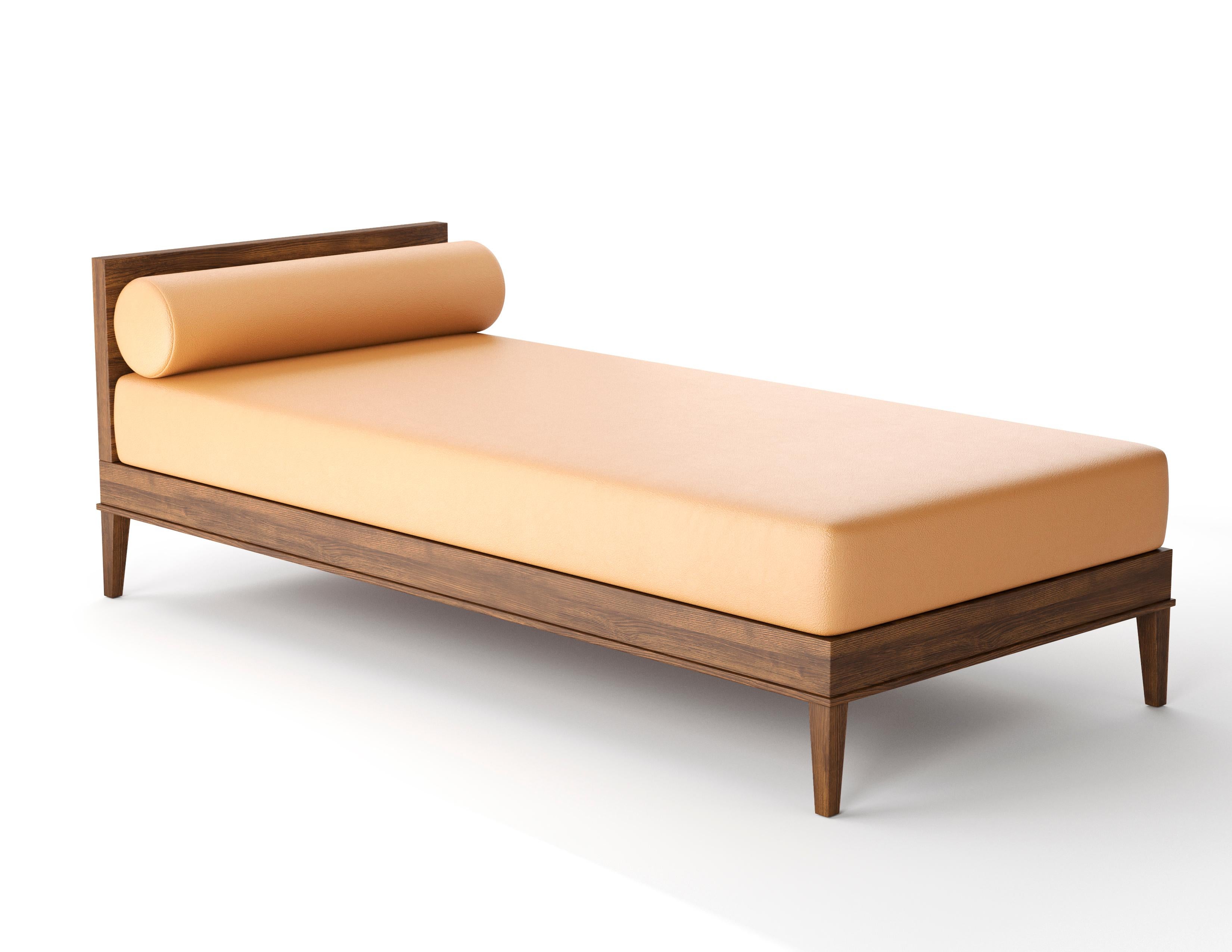 The Randolph daybed is a stylish and modern piece that can be used in any room. Hand made in our shop in Brooklyn it has a foam mattress wrapped in down & feather with a loose decorative bolster all crafted by hand. Wood frame and legs made in your