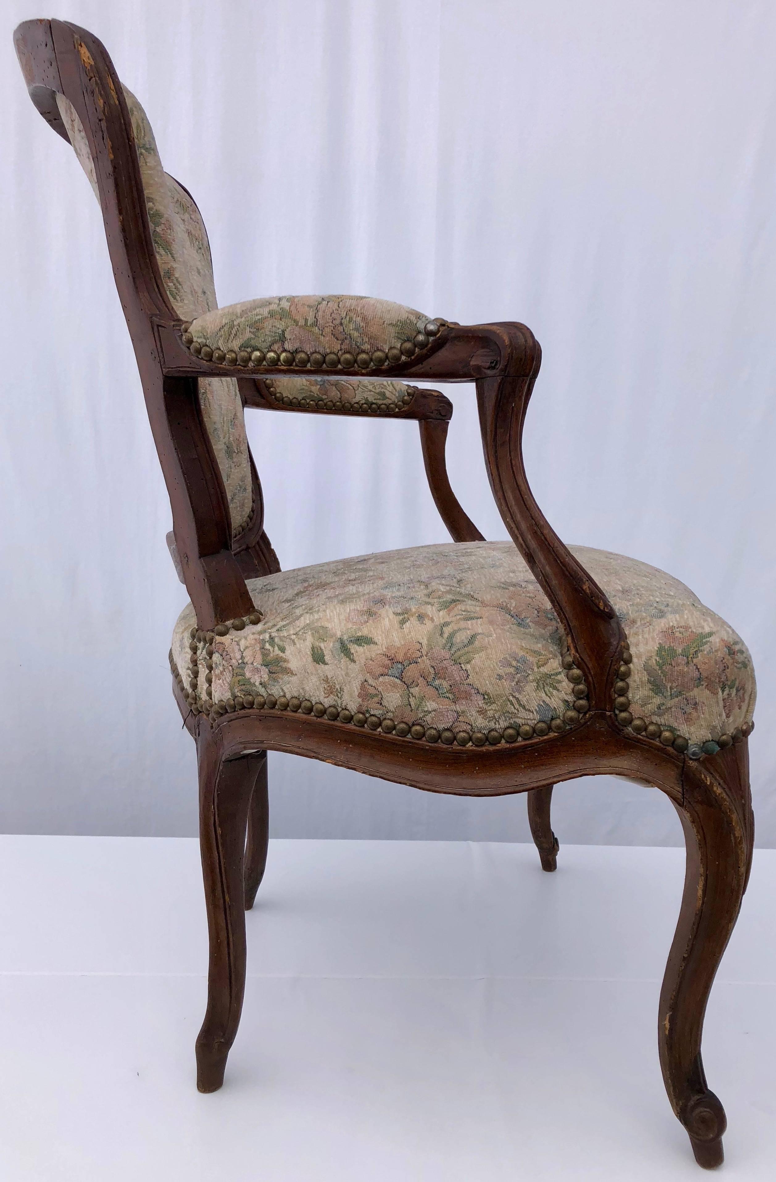 Louis XV Upholstered French Bergère Armchair with Hand-Carved Flower on Front, Walnut For Sale