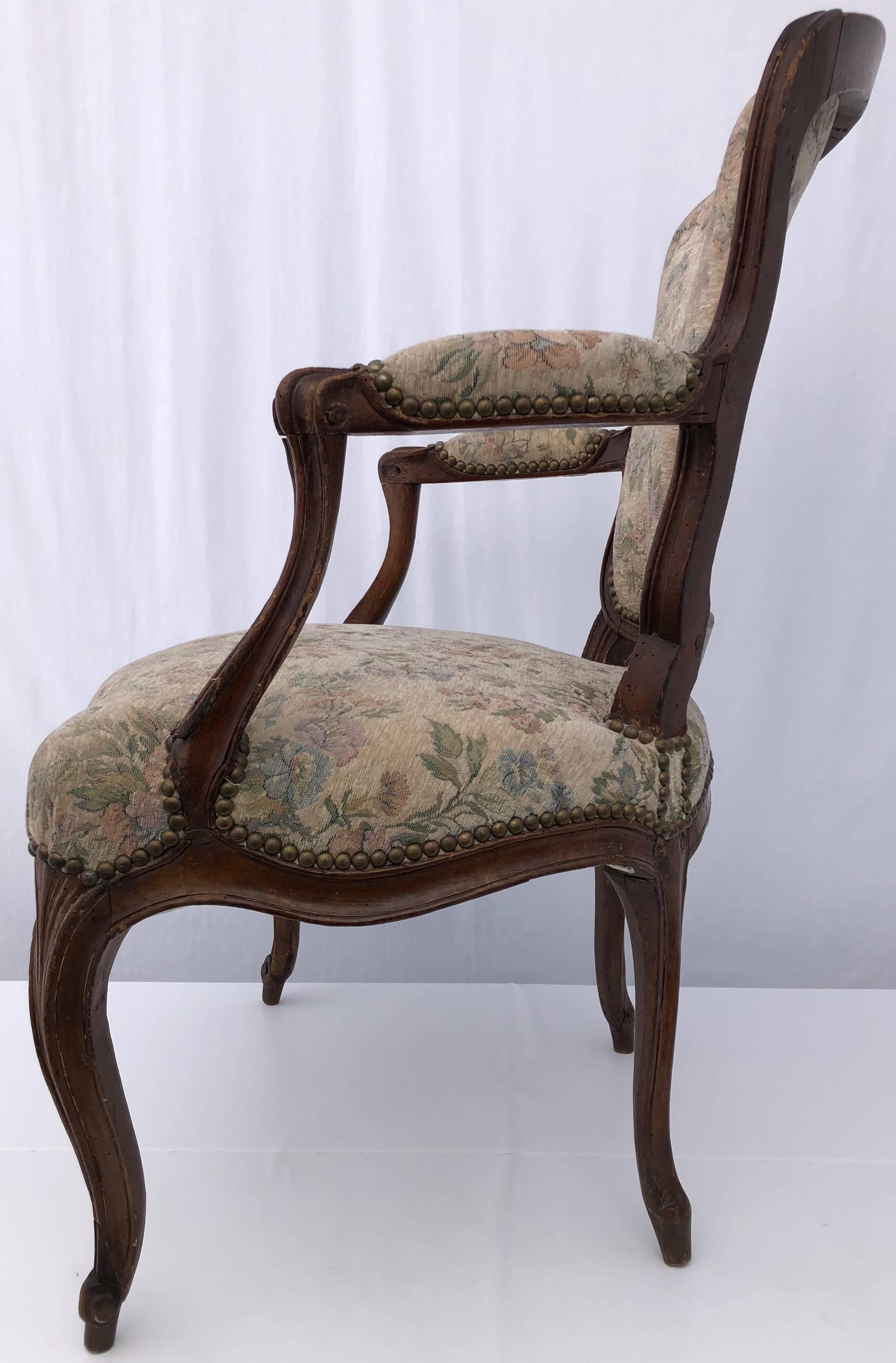 Upholstered French Bergère Armchair with Hand-Carved Flower on Front, Walnut In Good Condition For Sale In Petaluma, CA