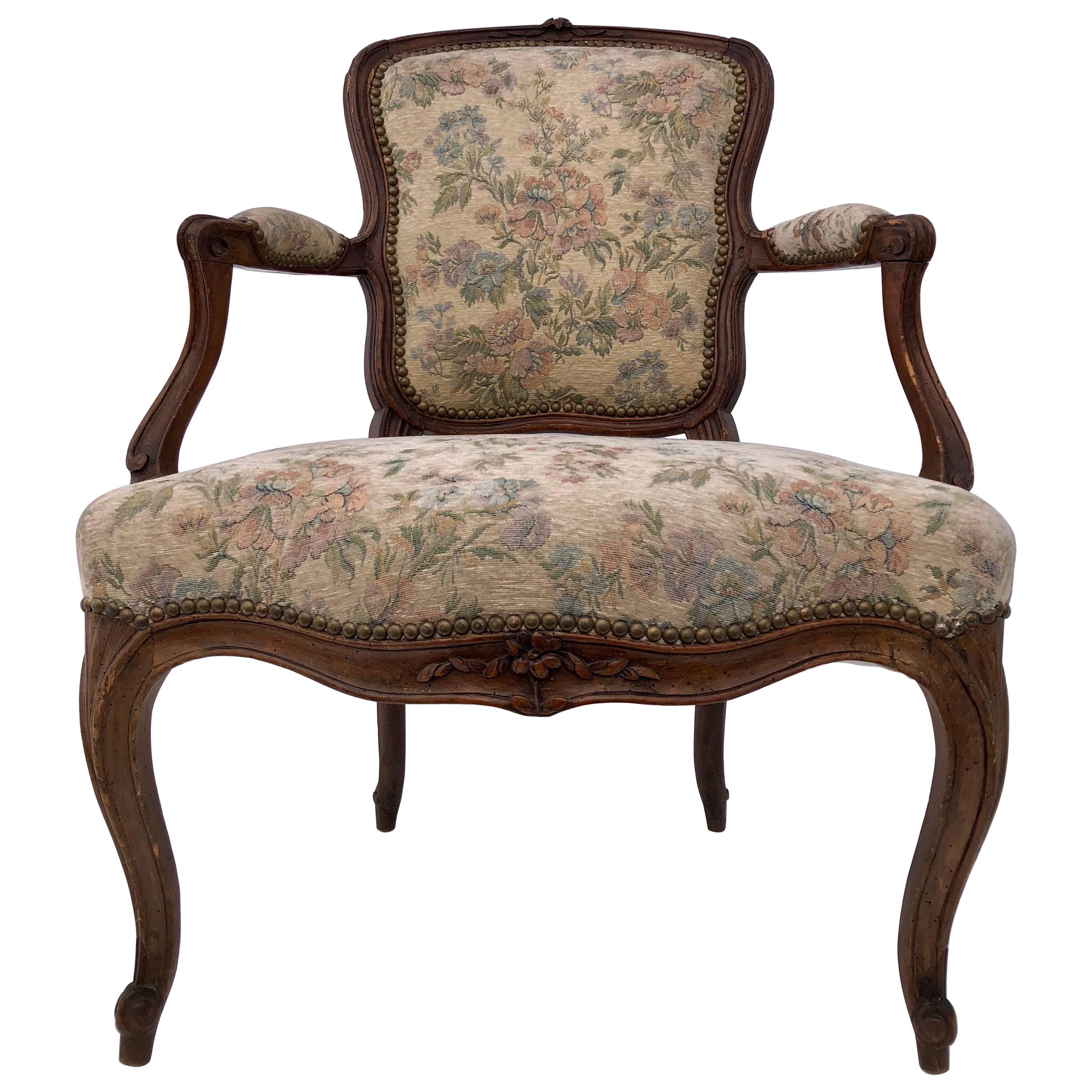 Upholstered French Bergère Armchair with Hand-Carved Flower on Front, Walnut For Sale