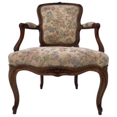 Upholstered French Bergère Armchair with Hand-Carved Flower on Front, Walnut