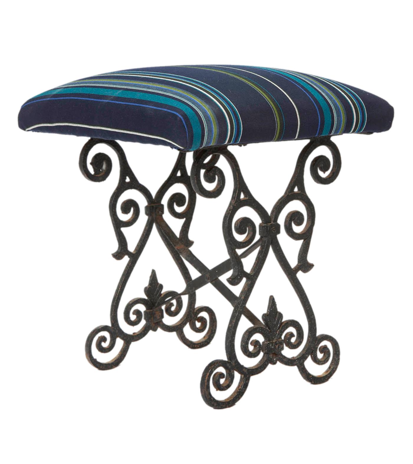 Deco handcrafted iron base with hammered iron and ornate scrolls.
The seat, on an oak platform has new upholstery in an indoor/outdoor Sunbrella stripe. New padding and paint. 