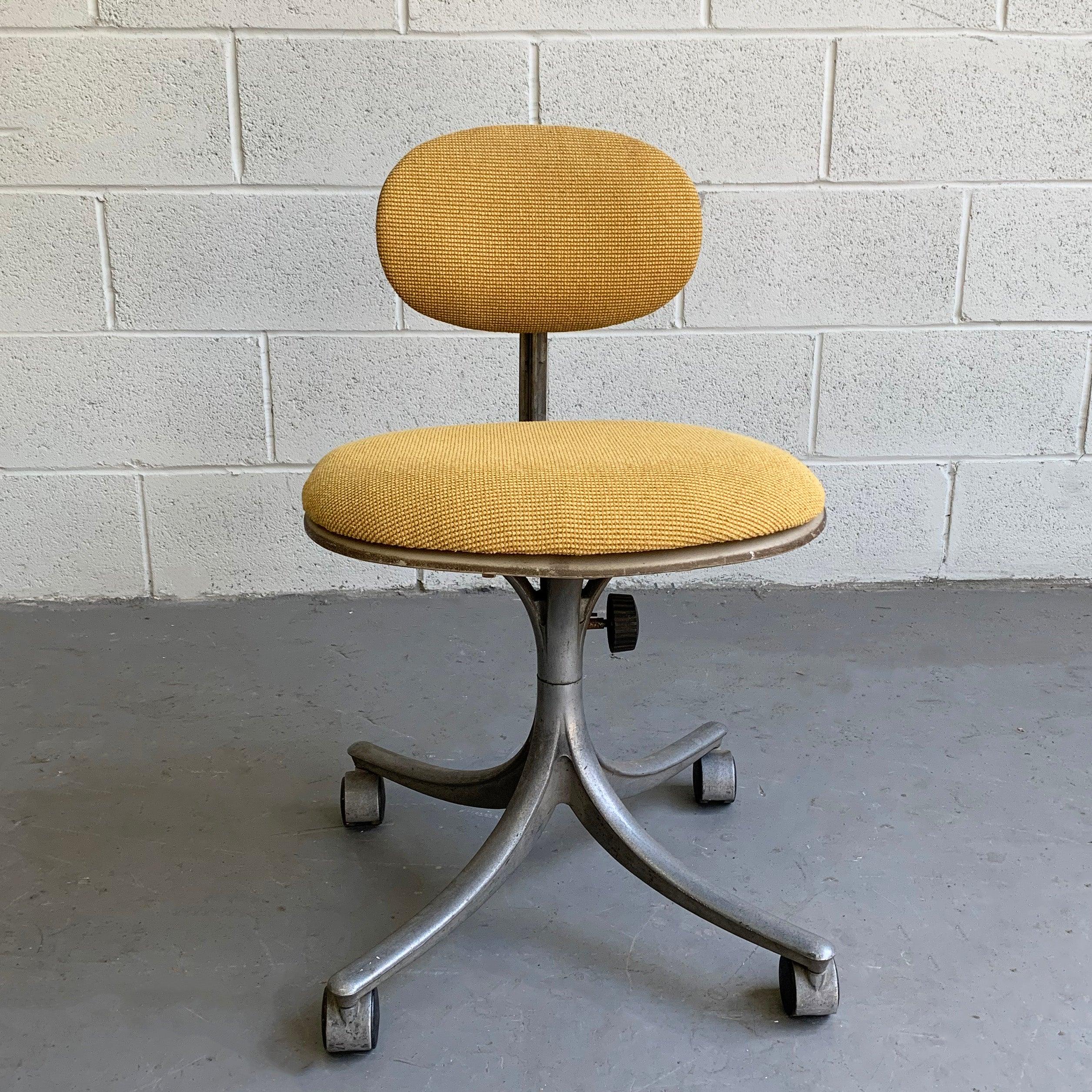 Mid-Century Modern, rolling, swivel, office task chair by Jorgen Rasmussen for Knoll features a light weight, aluminum frame with seat and back reupholstered in a yellow, woven cotton blend.