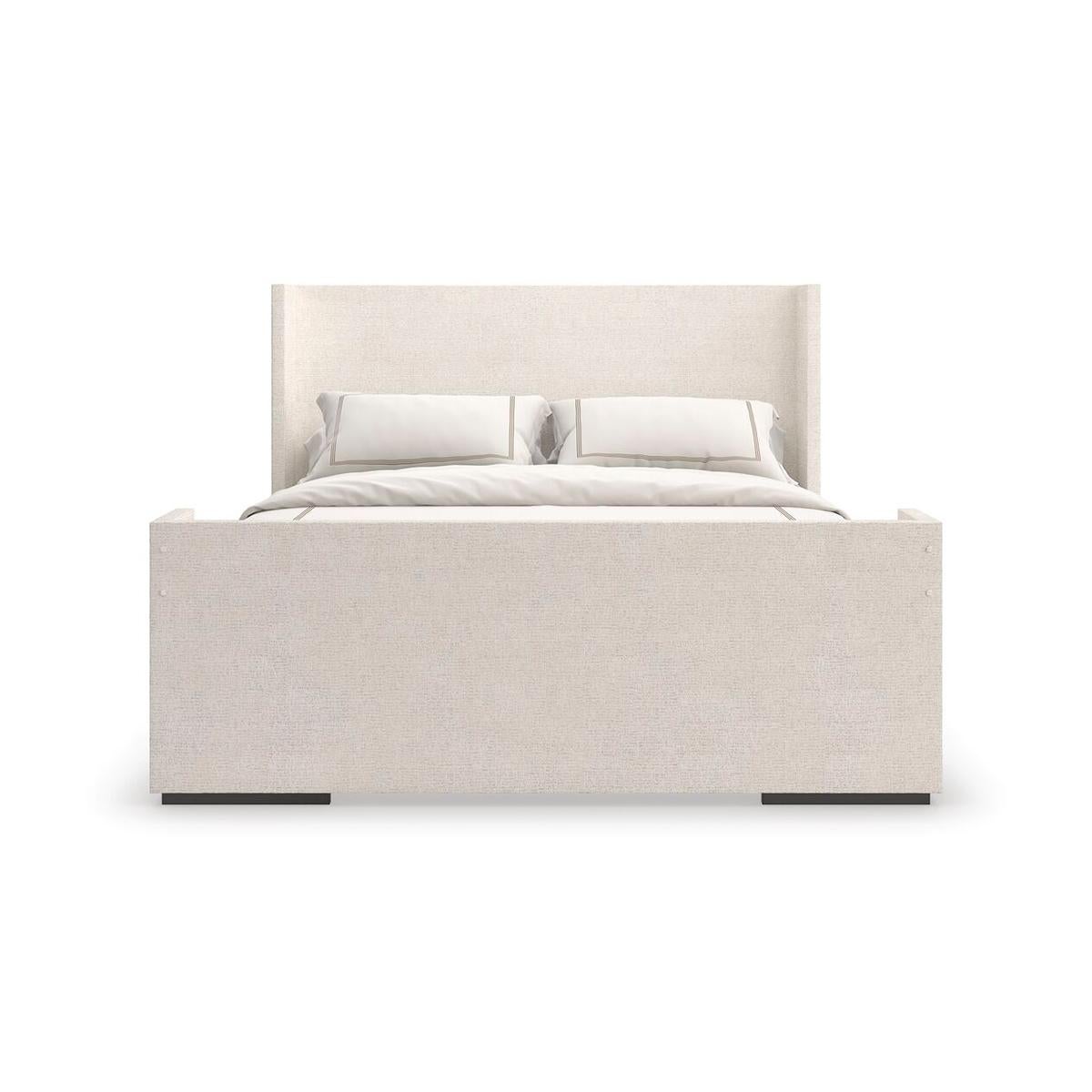 Dressed in a soft chenille fabric, this king bed brings an air of effortless elegance and enveloping comfort. Its simple, geometric form and soothing neutral hue blend beautifully with classic or modern design aesthetics.

Raised on contrasting feet