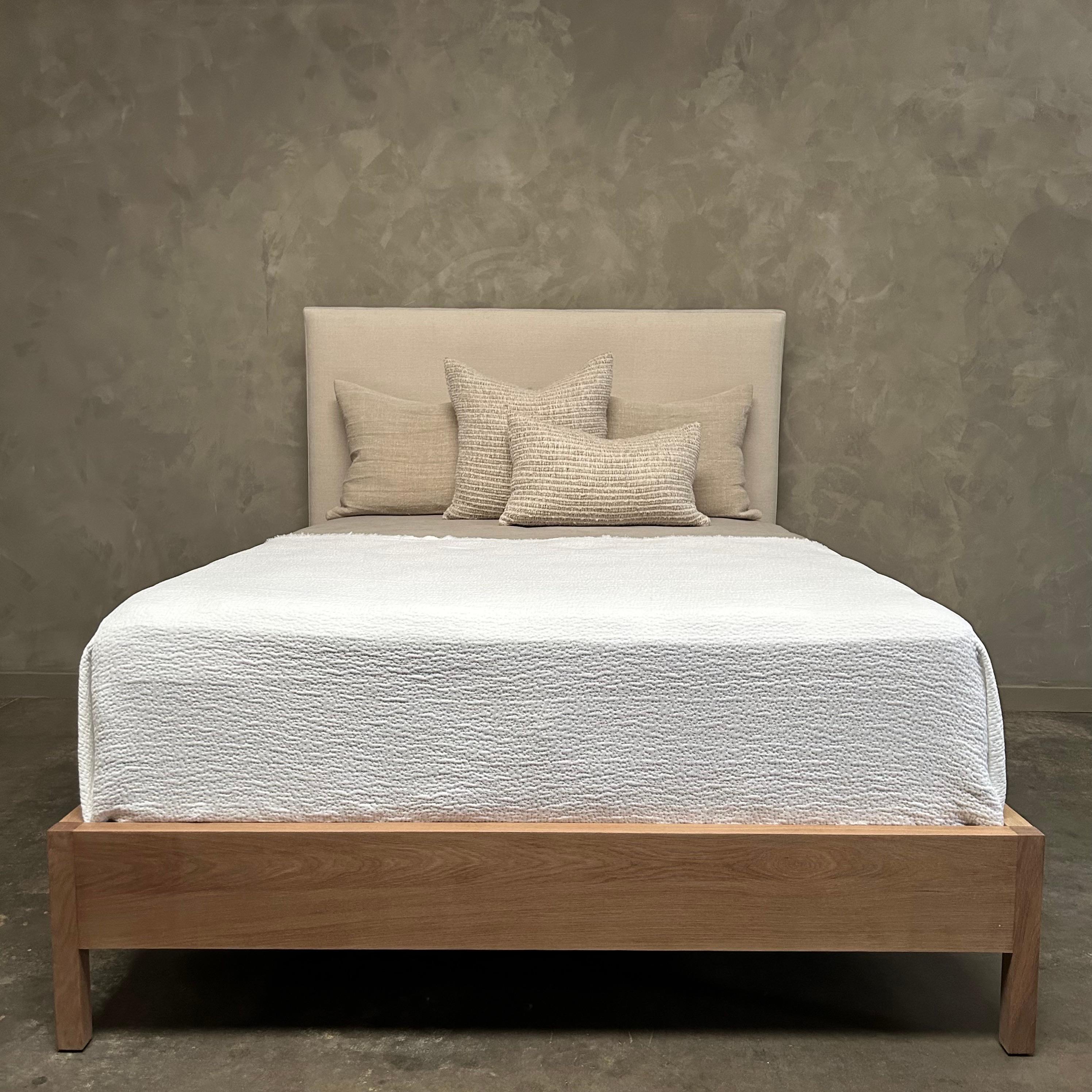 linen and wood bed frame