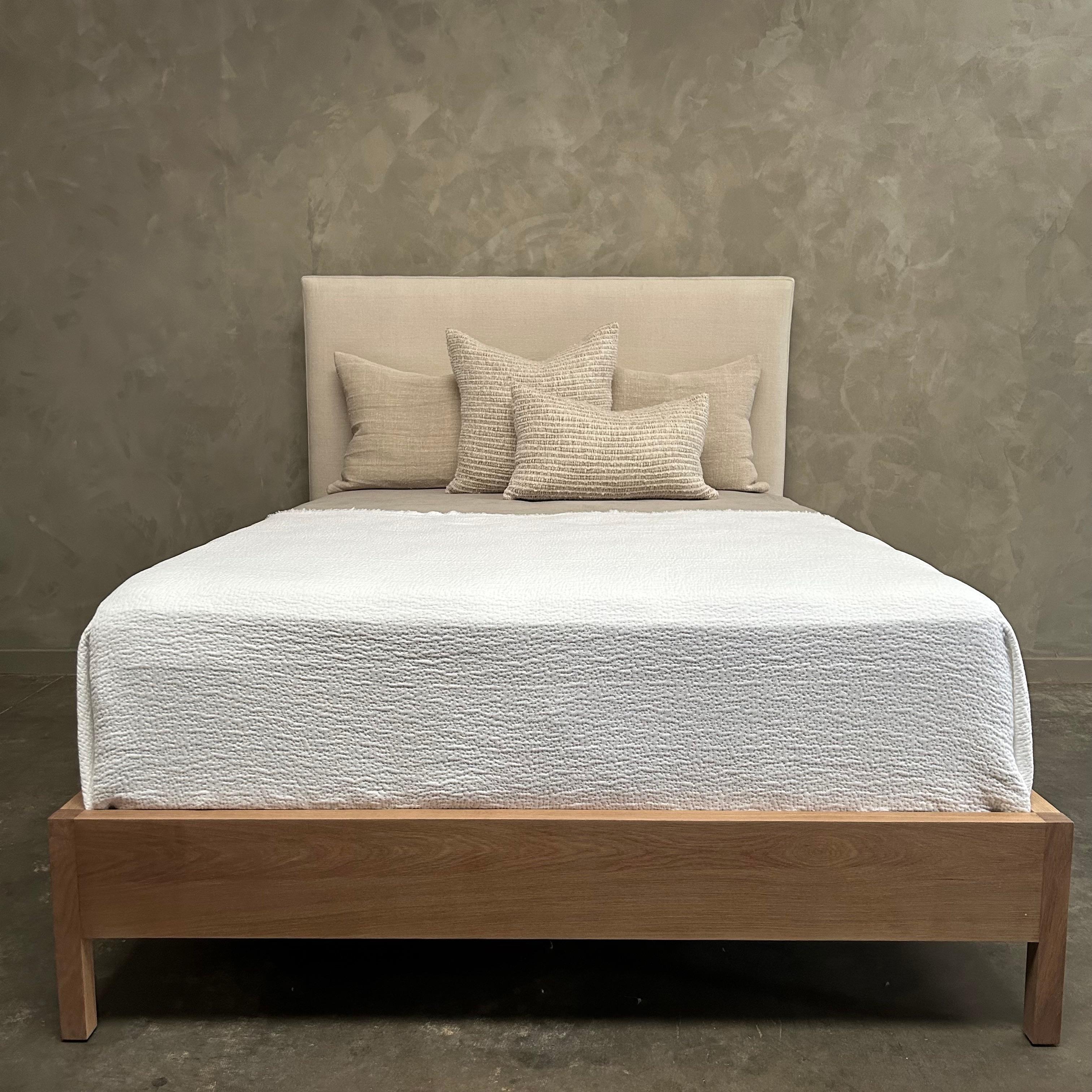 white linen platform bed