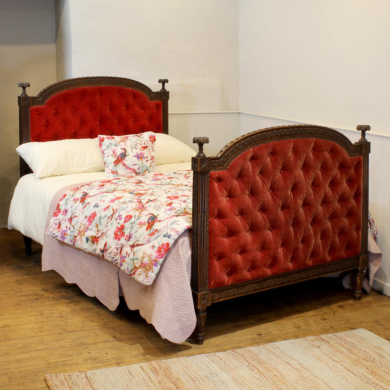 A Louis XVI style bed with an oak frame and button upholstered panels in red velvet.
The bed can be reupholstered in a fabric of your choice for an additional cost.

This bed accepts a standard double, 4ft 6in (54 in), base and mattress set, with