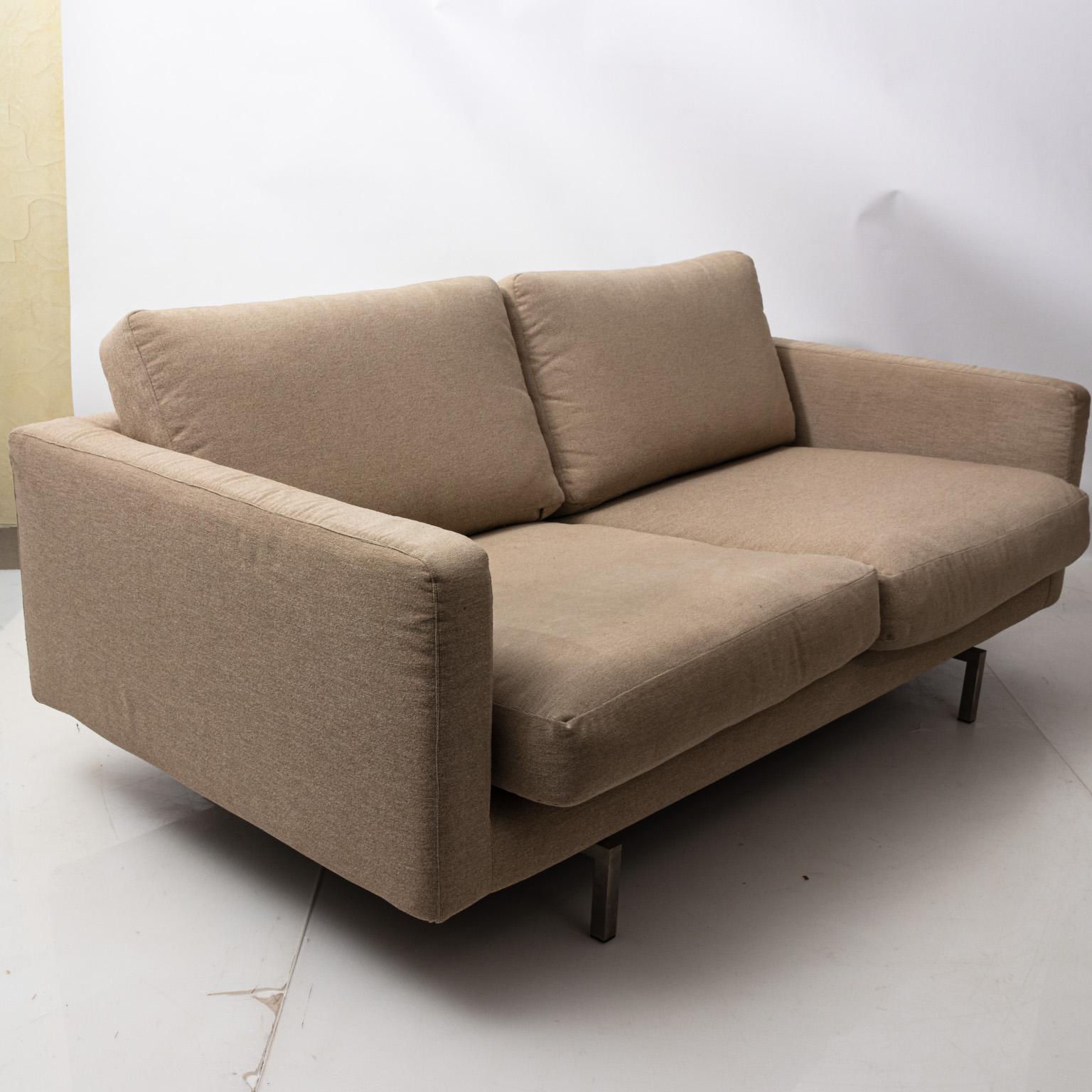 Modern two-seat loveseat by Niels Bendtsen for Bensen with nickel plated steel legs and removable fabric covers to dry clean, circa 2003. Please note of wear consistent with age including minor oxidation to the steel legs and used condition to