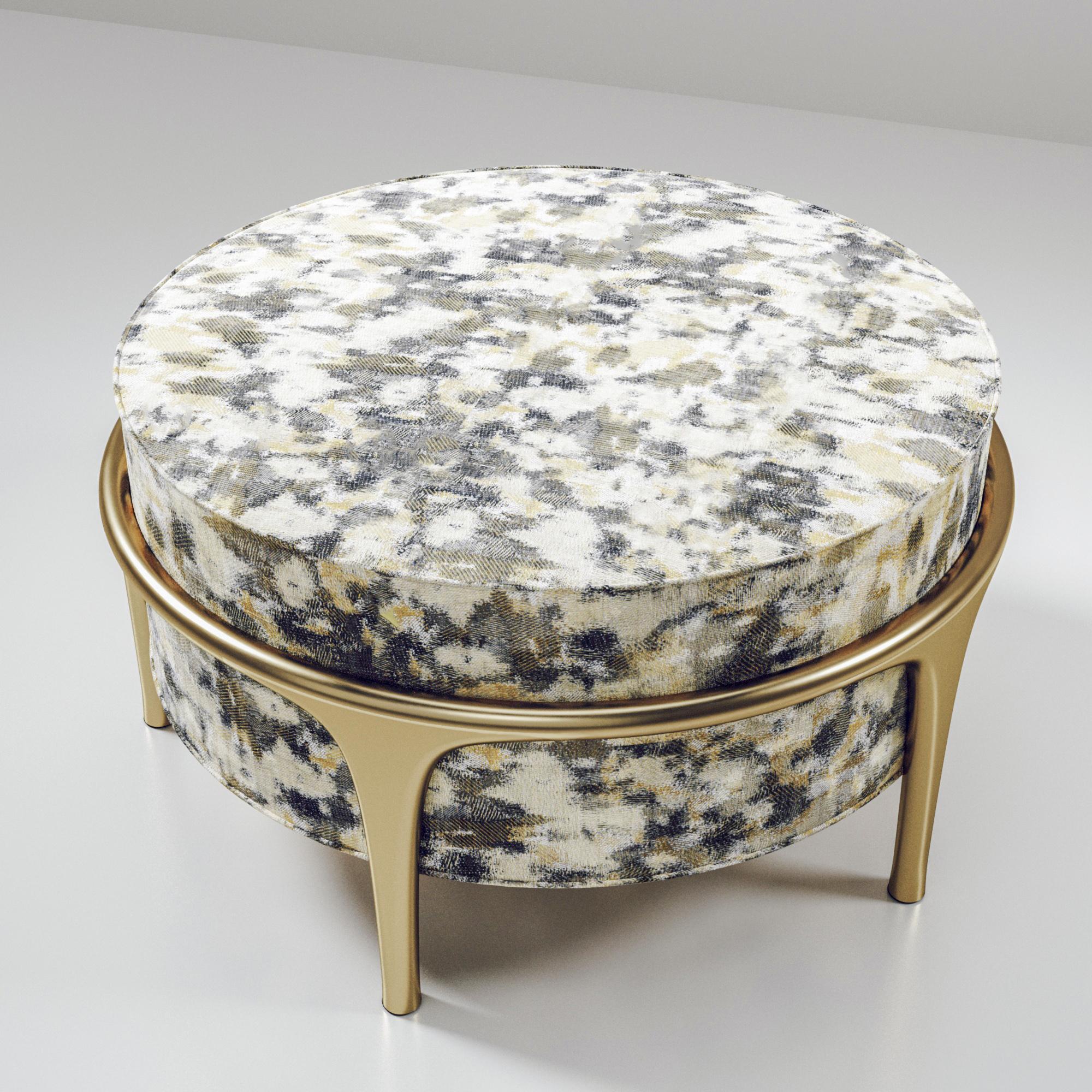 The Ramo Ottoman by R & Y Augousti is an elegant and versatile piece. The upholstered piece in a camouflage Pierre Frey fabric provides comfort while retaining a unique aesthetic with the bronze-patina brass frame and details. This listing is priced