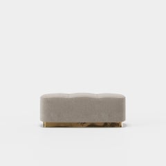 Upholstered Ottoman with Sculpted Metallic Plinth Base