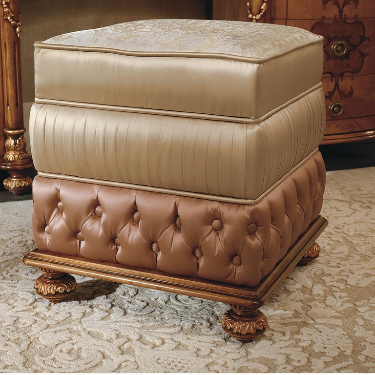 An ornate design where to pleasantly sit while getting ready for the day or preparing for the night. This refined pouf will be a spot-on addition to the Nabucco Vanity Desk, sharing with it the precious carved details coated in gold leaf that are