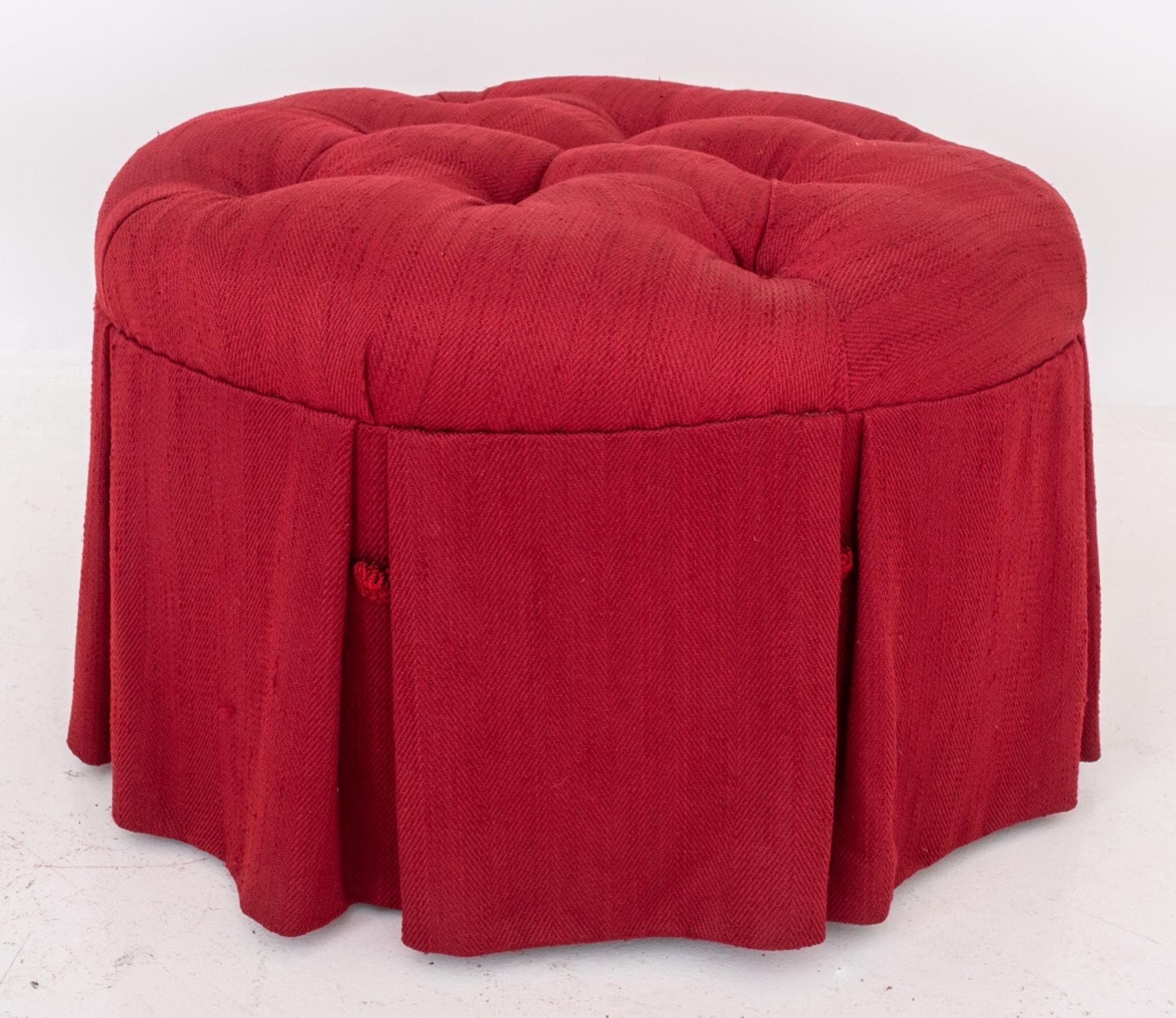 Upholstered 'pouf' or ottoman, circular with buttoned top and kick-pleated skirt, covered in a garnet red textile. In very good vintage condition. 

Dealer: S138XX 